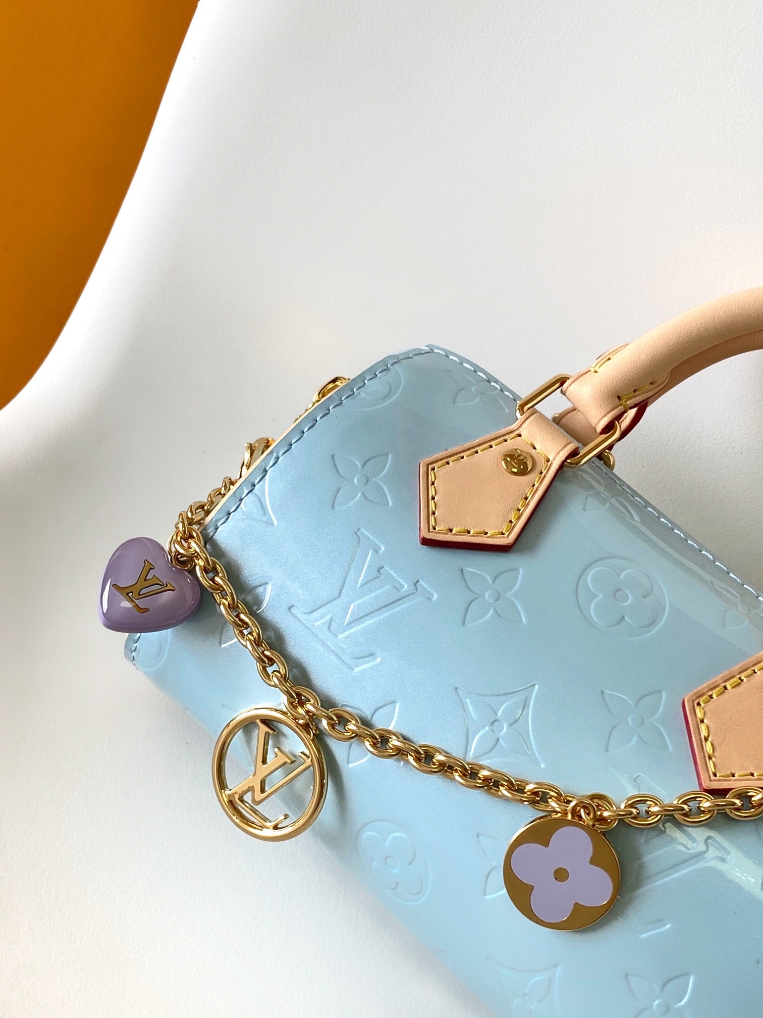 Louis Vuitton Pastel Blue Embossed Crossbody Barrel Bag with Gold Chain and Heart Charm