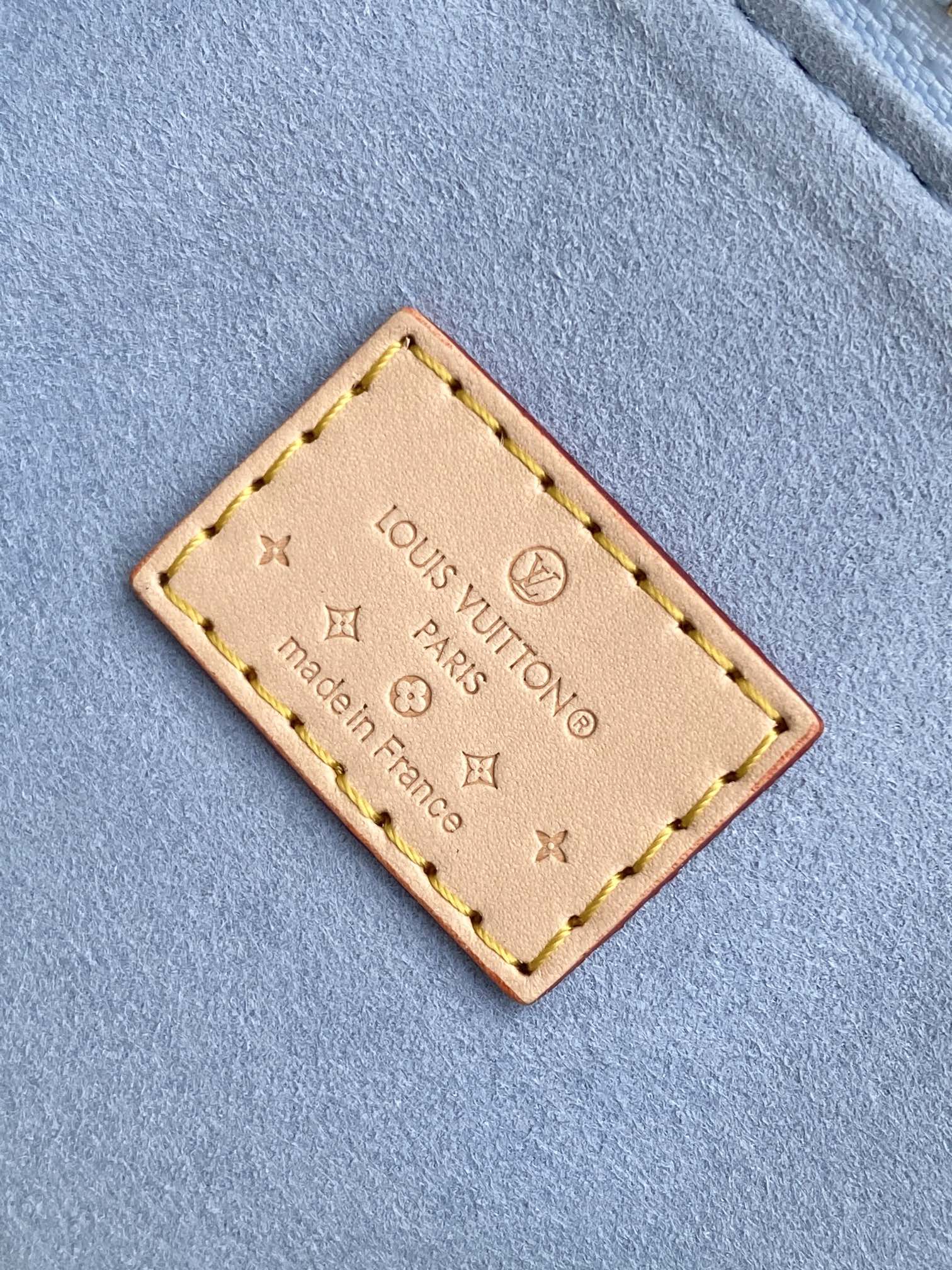 Louis Vuitton Pastel Blue Embossed Crossbody Barrel Bag with Gold Chain and Heart Charm