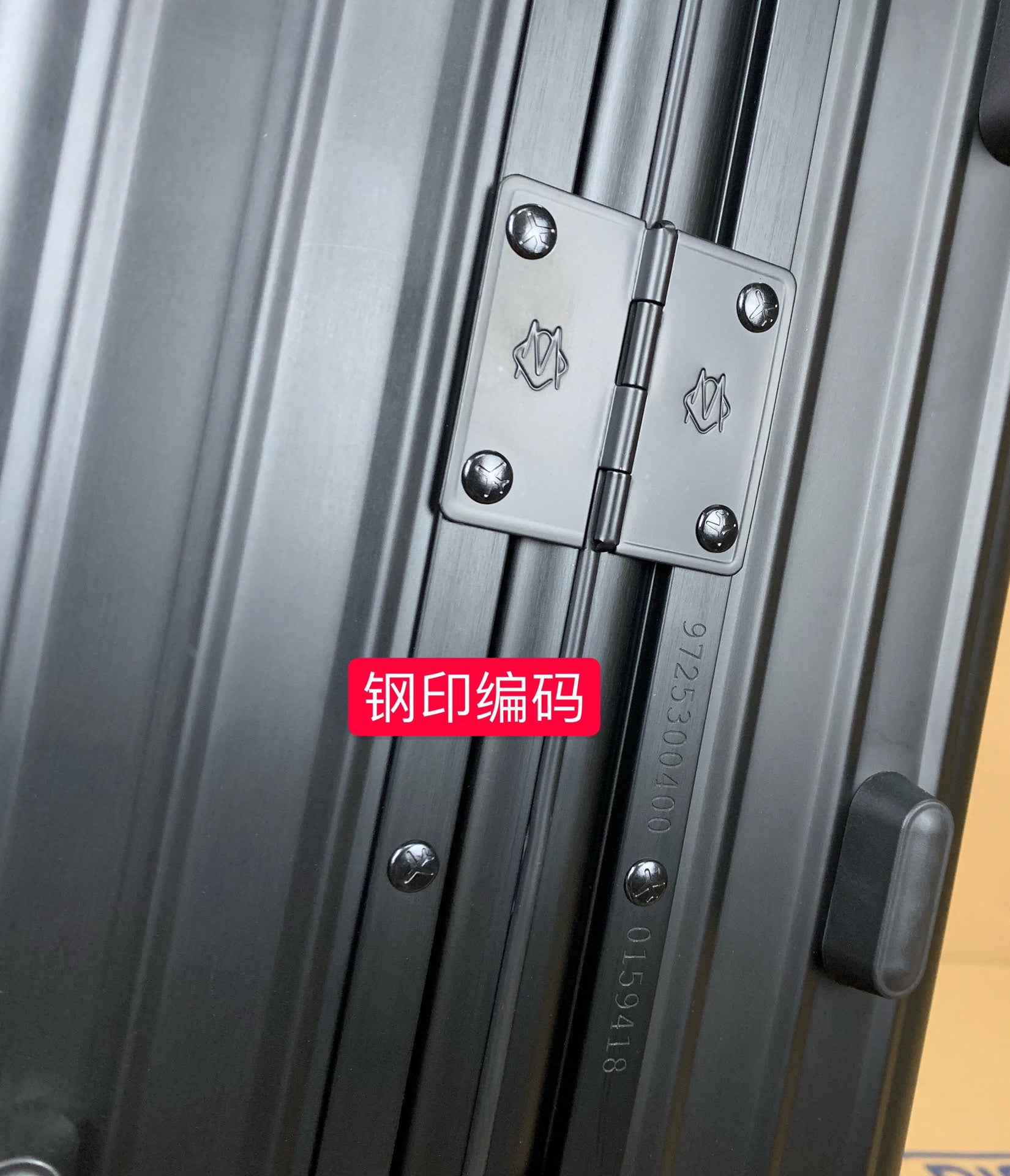 Sleek Matte Black Ribbed Carry-On Hardshell Spinner Suitcase