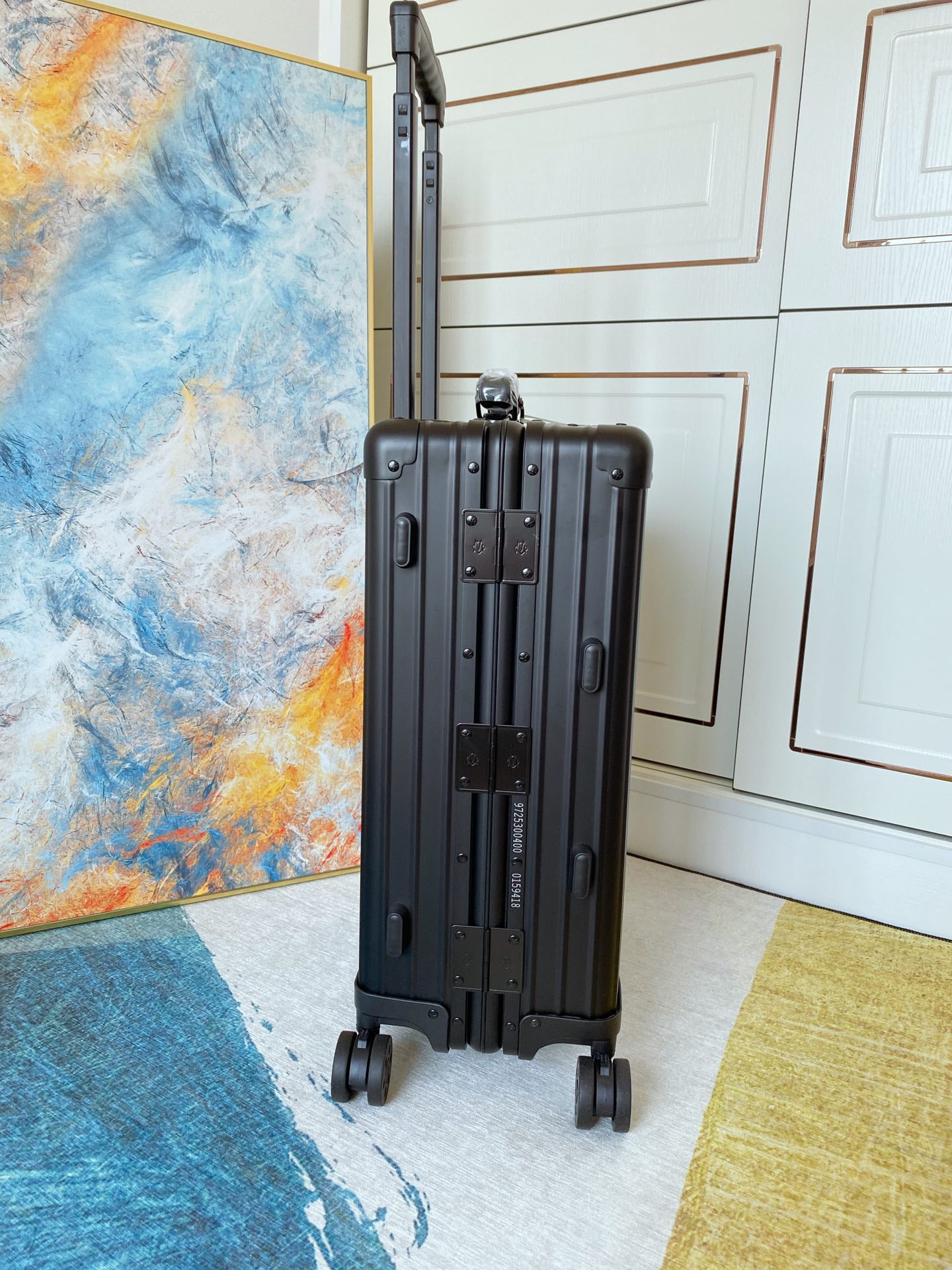 Sleek Matte Black Ribbed Carry-On Hardshell Spinner Suitcase