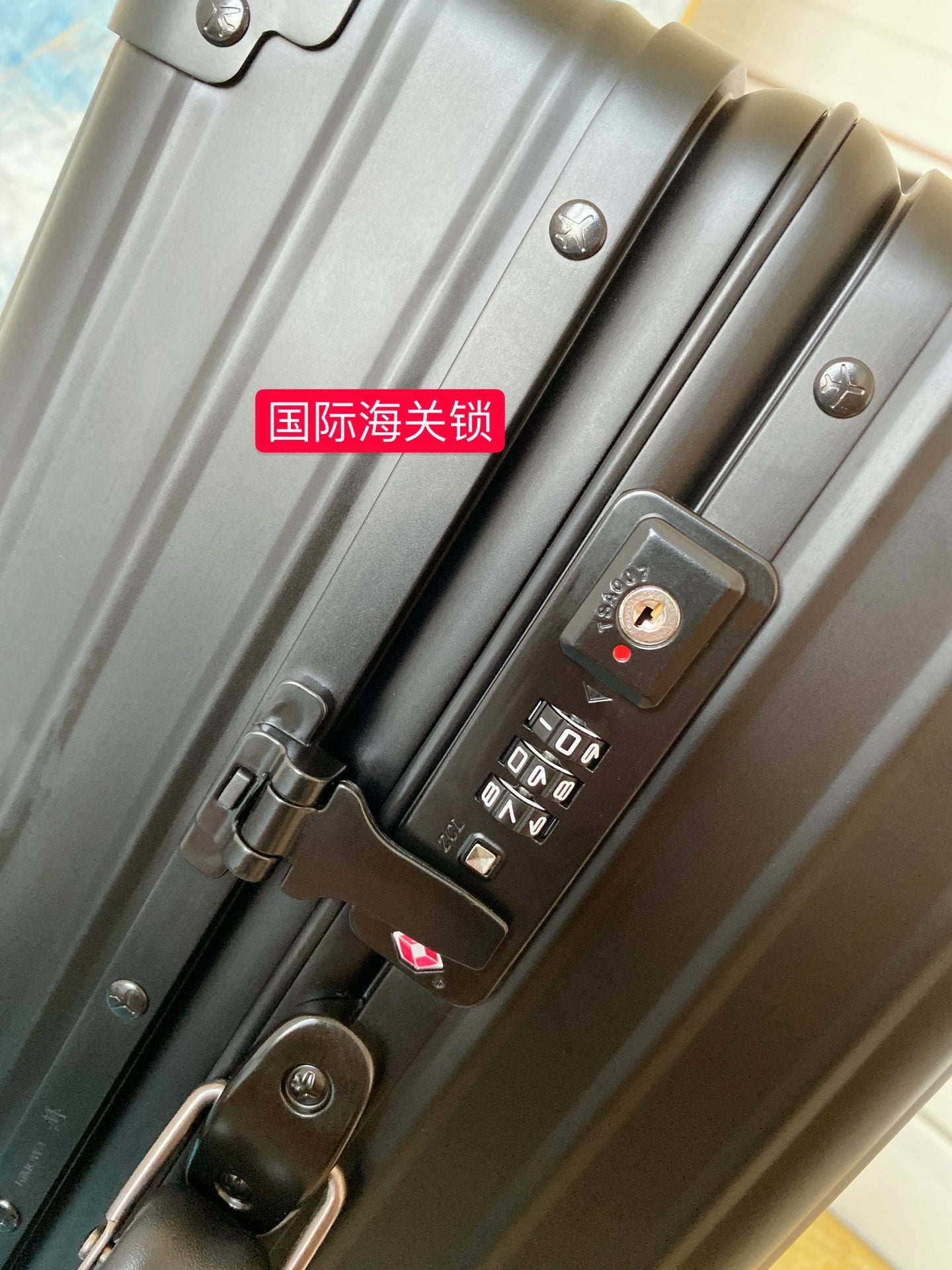 Sleek Matte Black Ribbed Carry-On Hardshell Spinner Suitcase