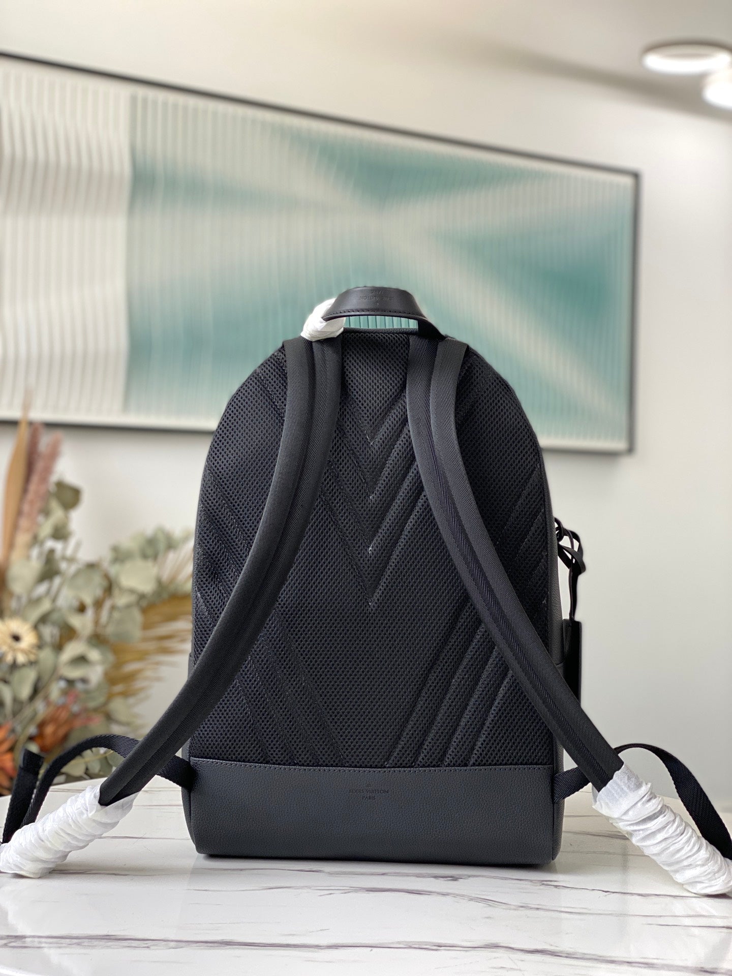 Louis Vuitton Luxury Matte Black Textured Leather Backpack with Pocket