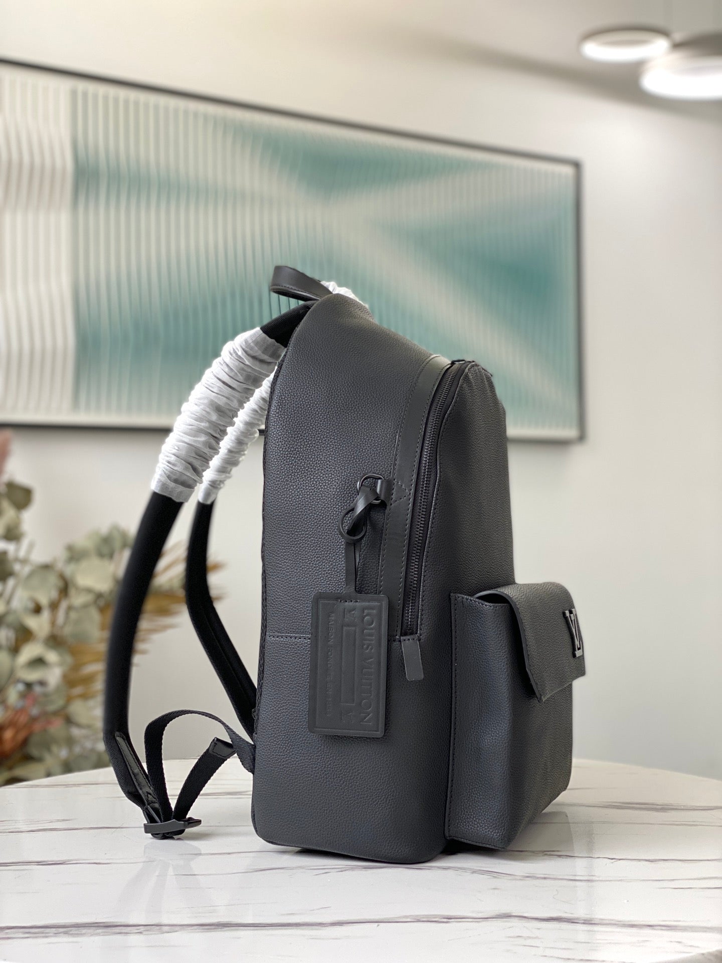 Louis Vuitton Luxury Matte Black Textured Leather Backpack with Pocket