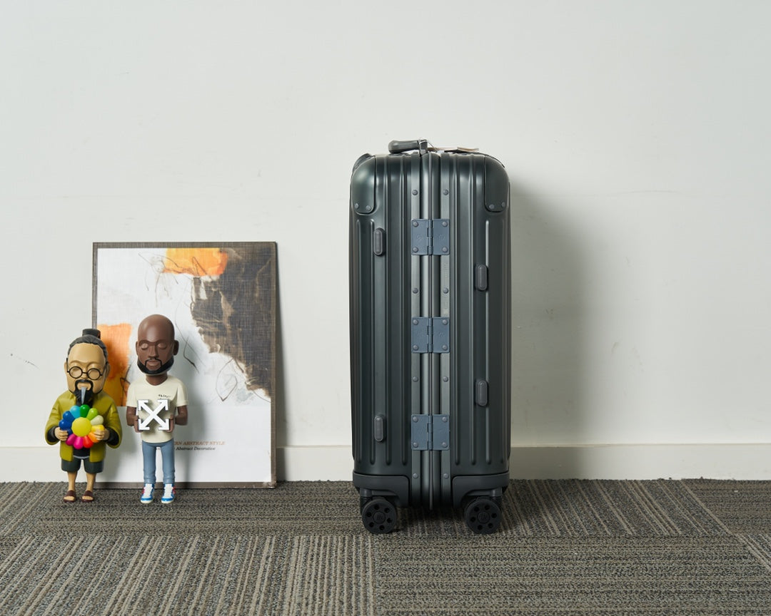 Sleek Black Ribbed Hardshell Carry-On Suitcase with Spinner Wheels