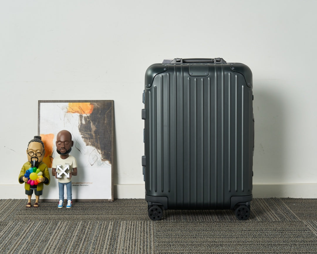 Sleek Black Ribbed Hardshell Carry-On Suitcase with Spinner Wheels