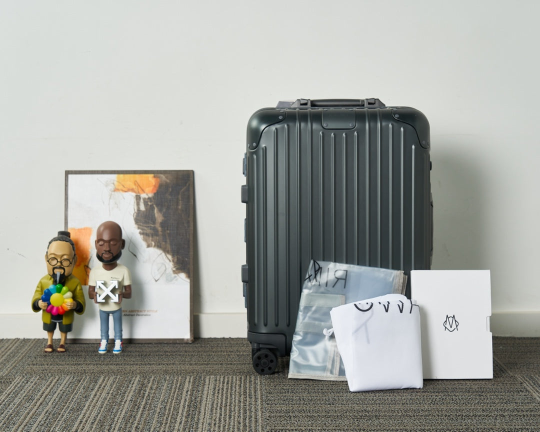Sleek Black Ribbed Hardshell Carry-On Suitcase with Spinner Wheels