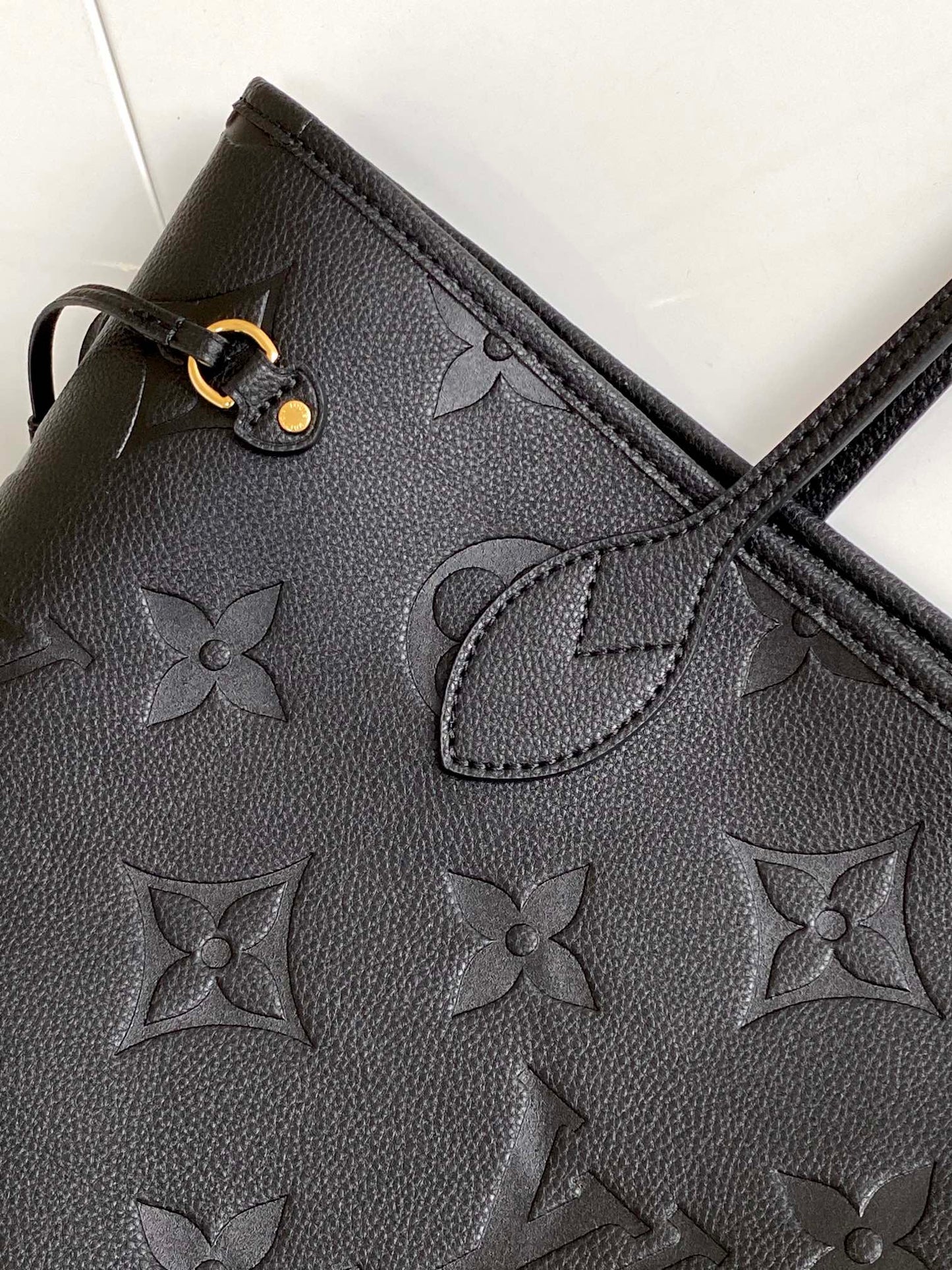 Louis Vuitton Elegant Black Embossed Leather Tote Bag with Double Handles