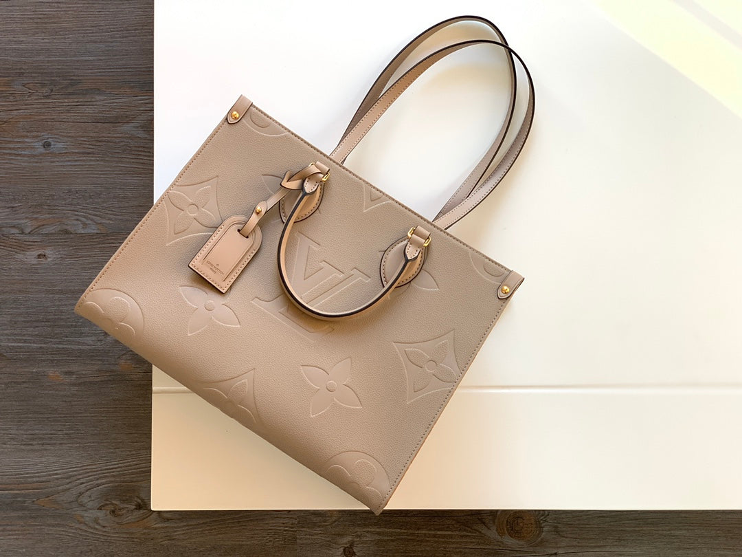 Louis Vuitton Elegant Taupe Embossed Leather Tote Bag with Top Handles