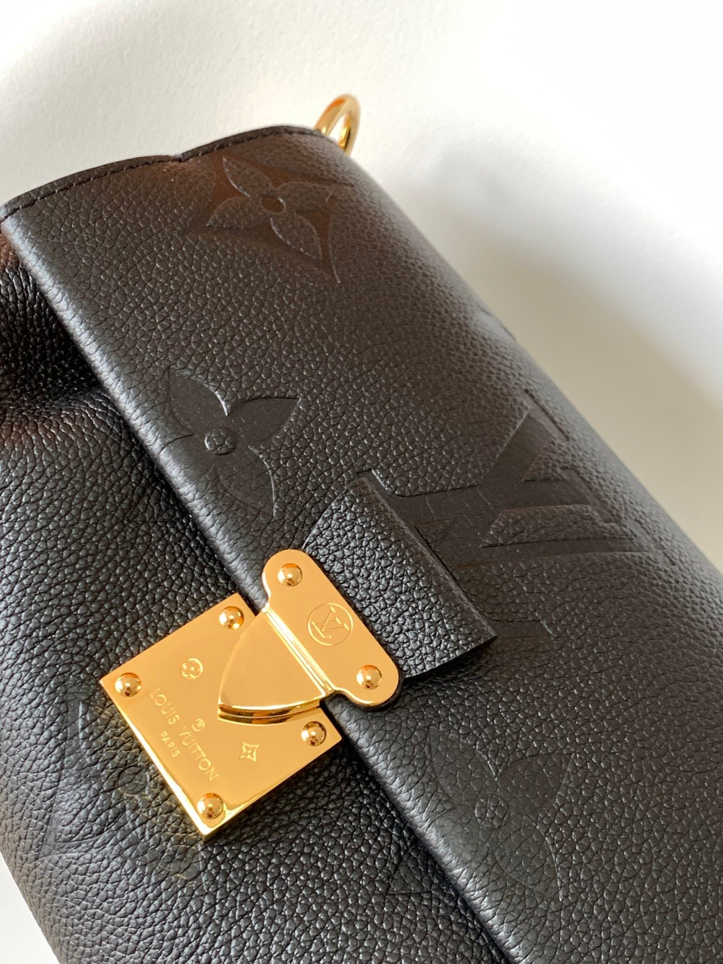 Louis Vuitton Elegant Black Embossed Leather Flap Bag with Gold Chain