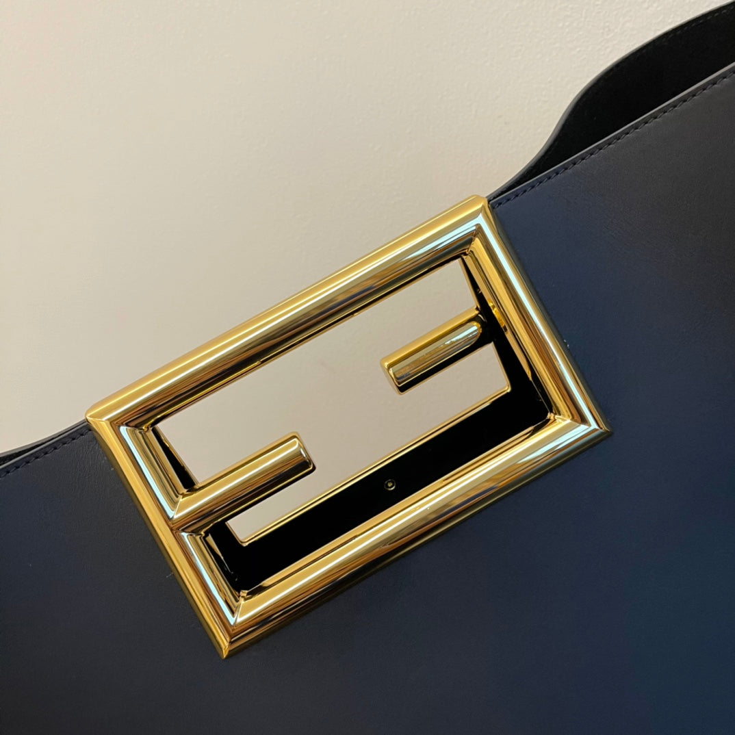Elegant Black Leather Handbag with Gold Rectangular Clasp and Detachable Shoulder Strap