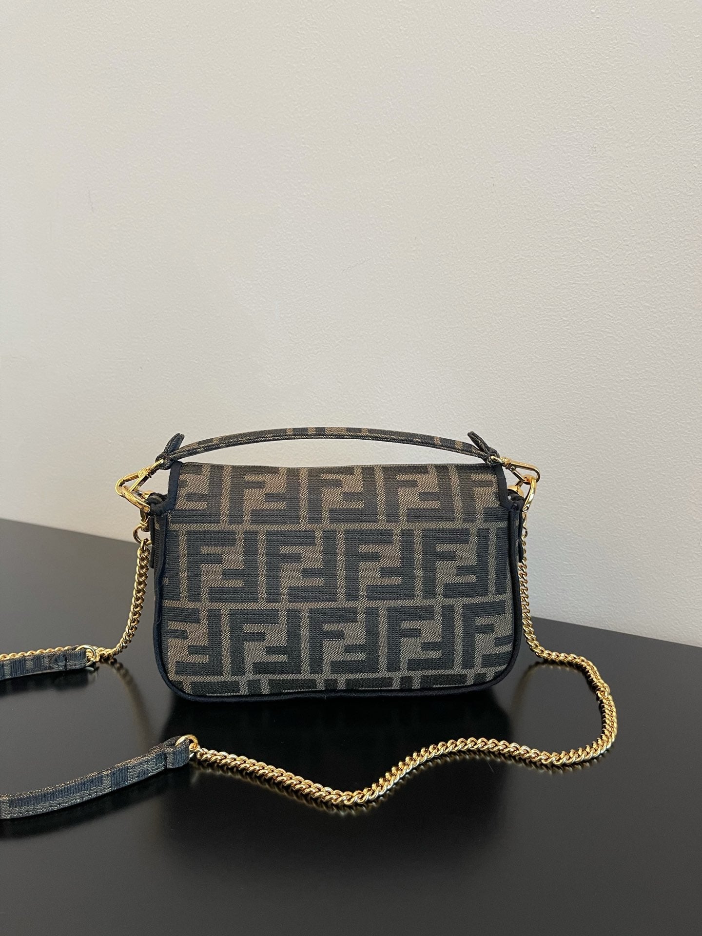 Fendi Mini Baguette Bag in Iconic FF Logo Canvas with Gold-Tone Hardware