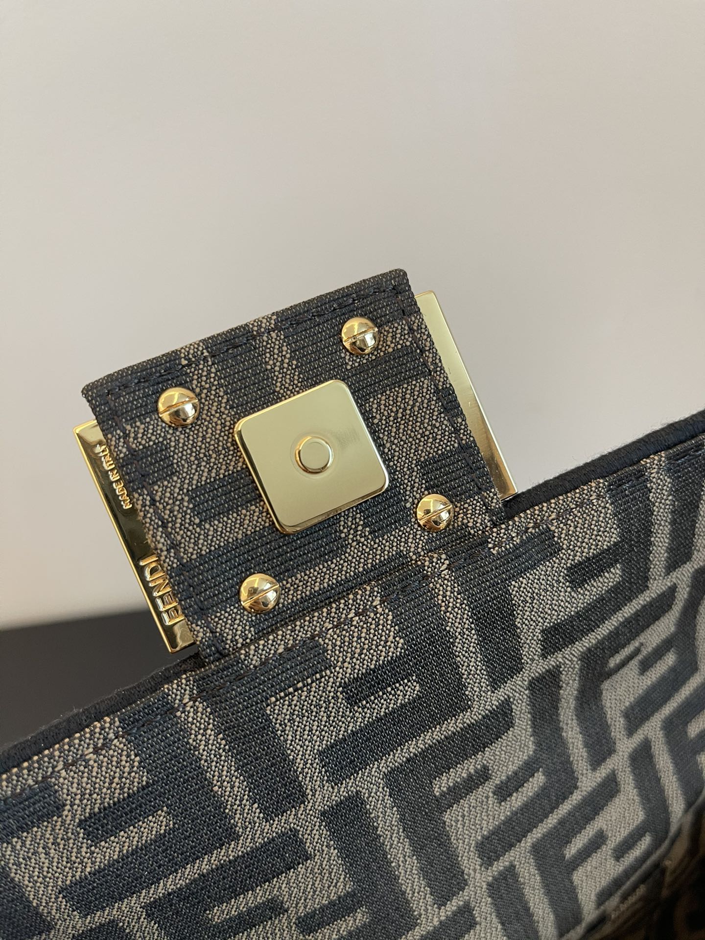 Fendi Mini Baguette Bag in Iconic FF Logo Canvas with Gold-Tone Hardware