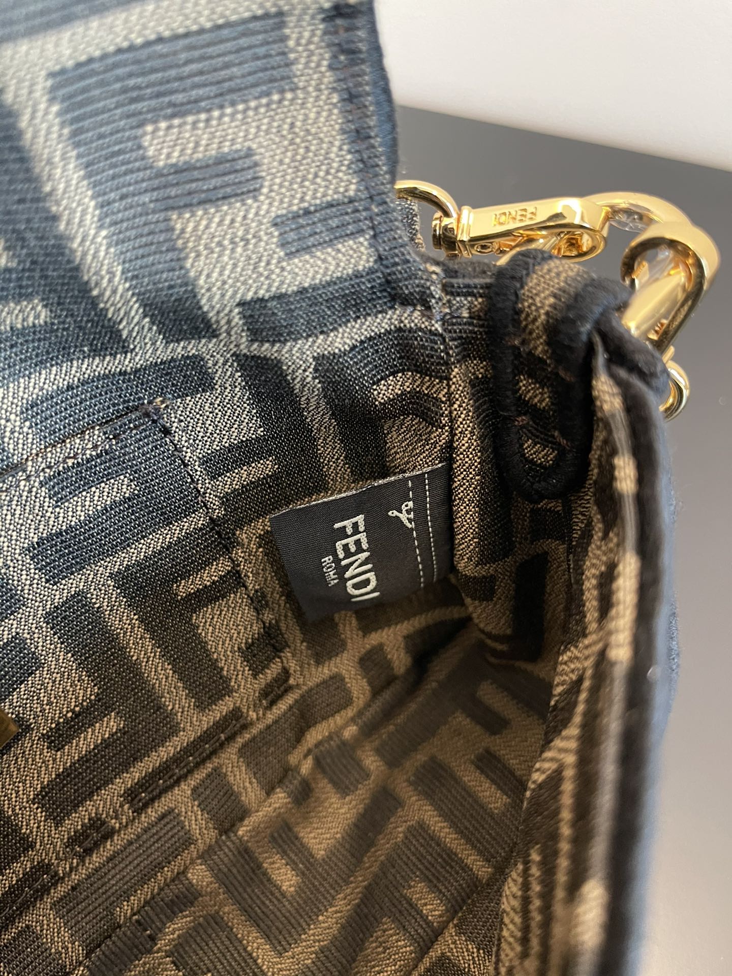 Fendi Mini Baguette Bag in Iconic FF Logo Canvas with Gold-Tone Hardware