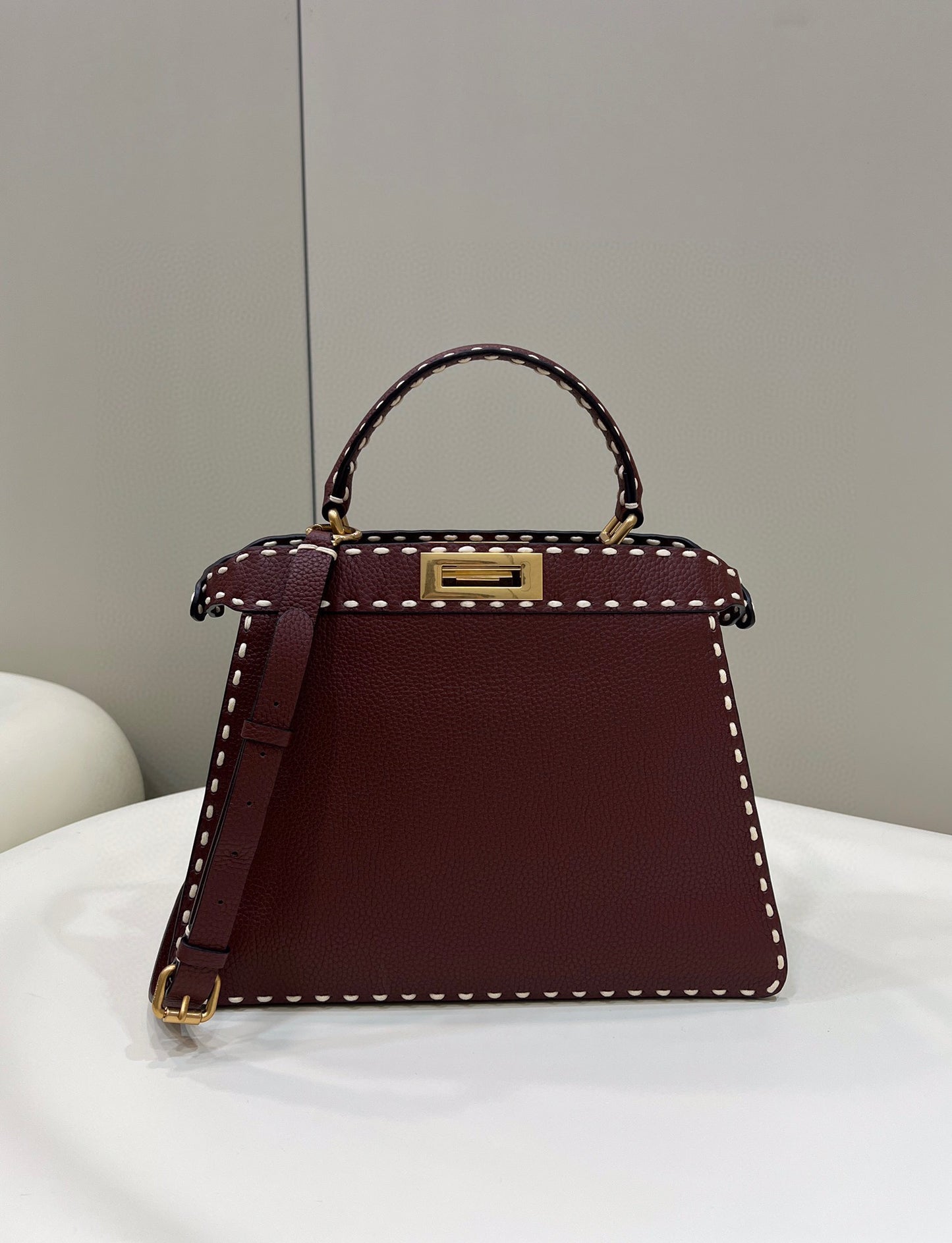 Sophisticated Burgundy Top Handle Handbag with White Contrast Stitching and Matching Wallet
