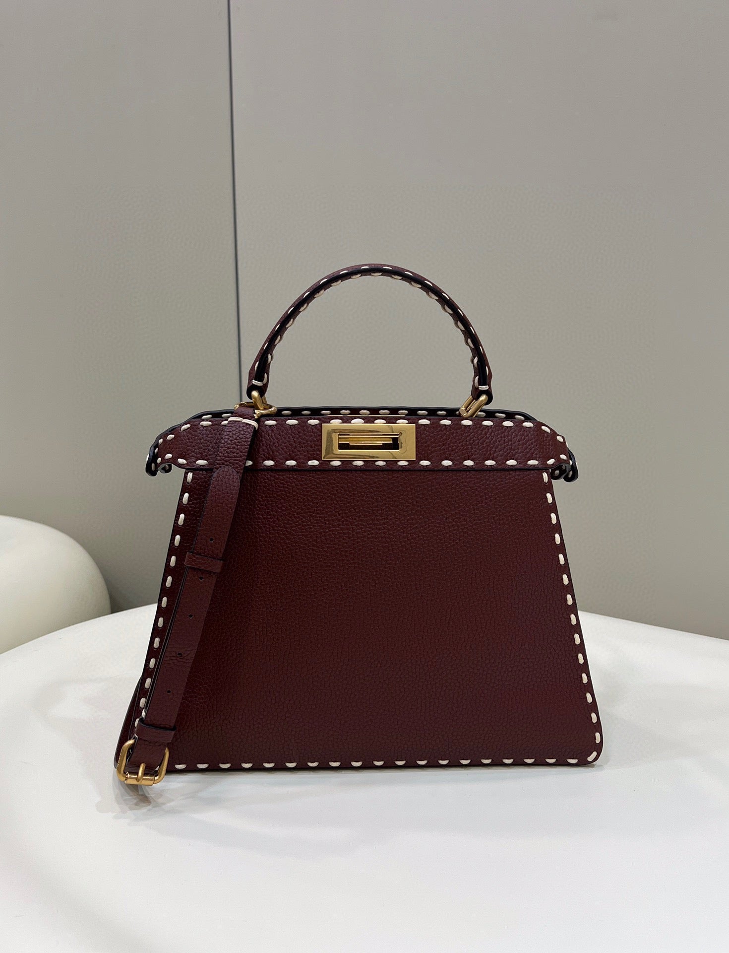 Sophisticated Burgundy Top Handle Handbag with White Contrast Stitching and Matching Wallet