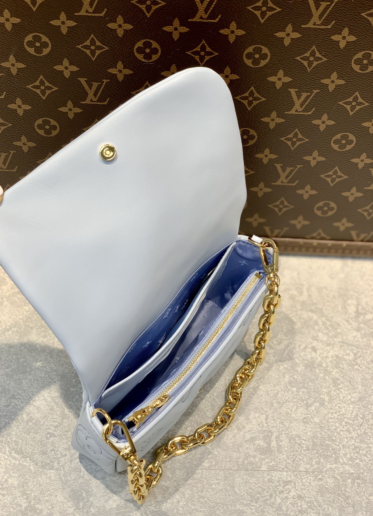 Louis Vuitton Light Blue Embossed Crossbody Bag with Wide Strap and Gold Chain