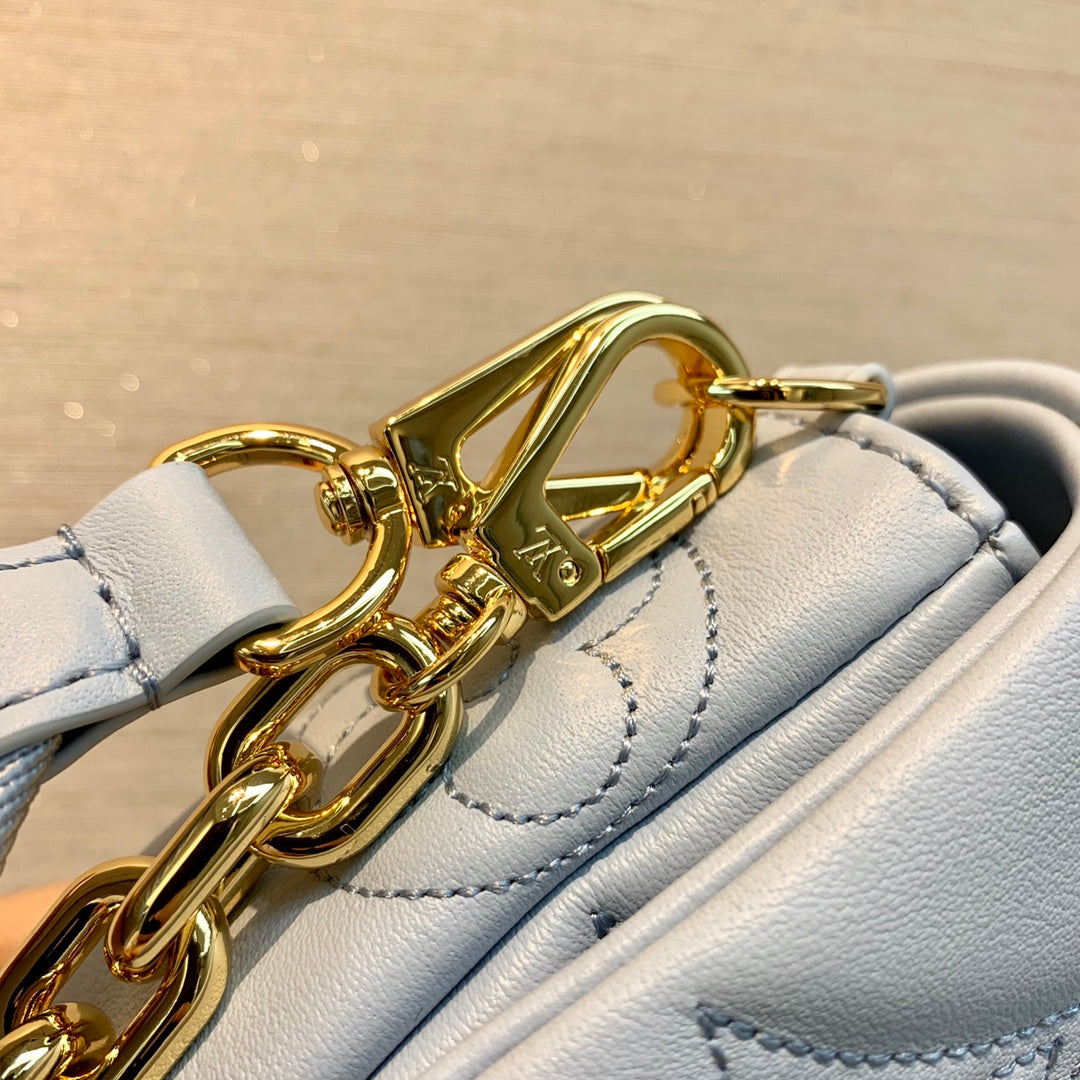 Louis Vuitton Light Blue Embossed Crossbody Bag with Wide Strap and Gold Chain