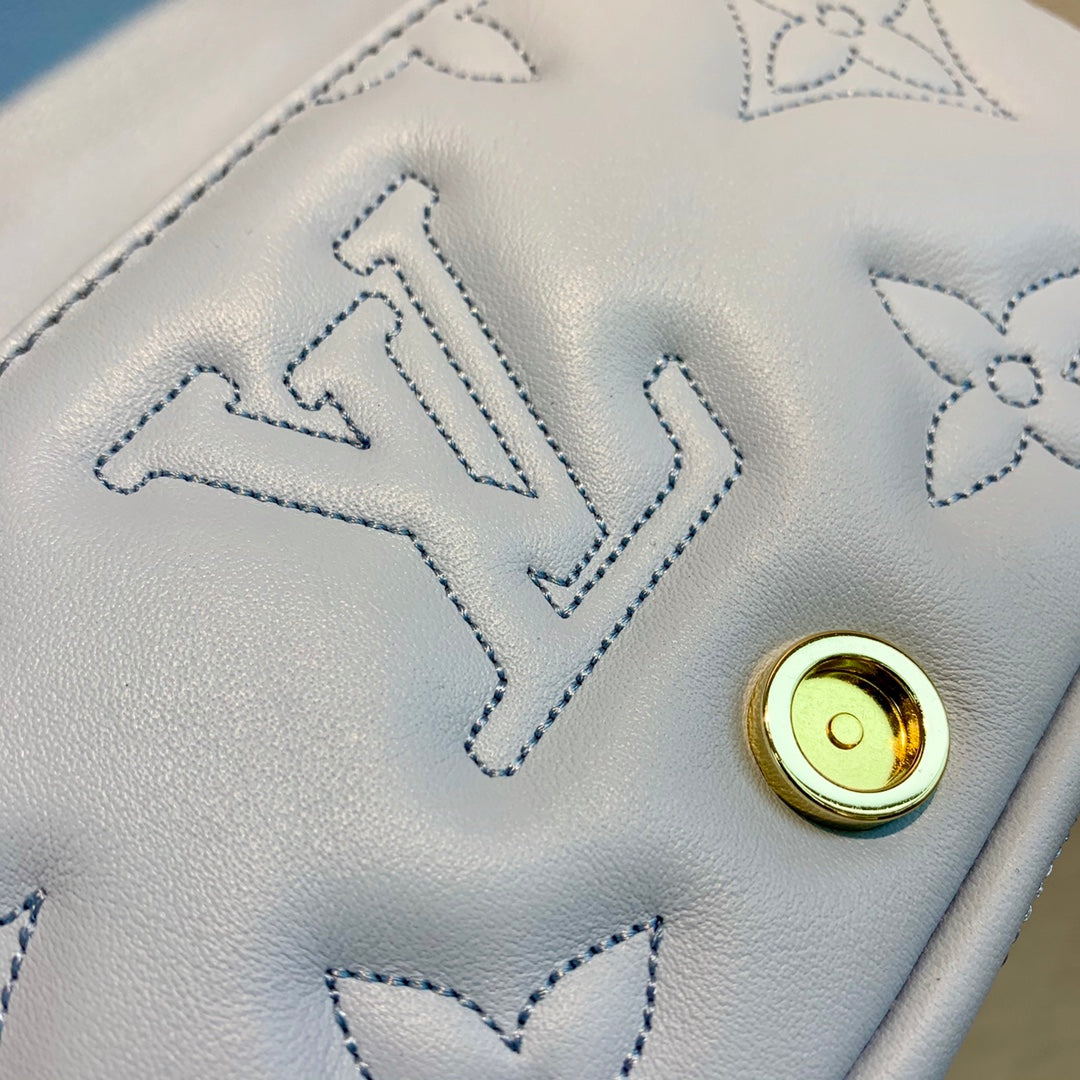 Louis Vuitton Light Blue Embossed Crossbody Bag with Wide Strap and Gold Chain