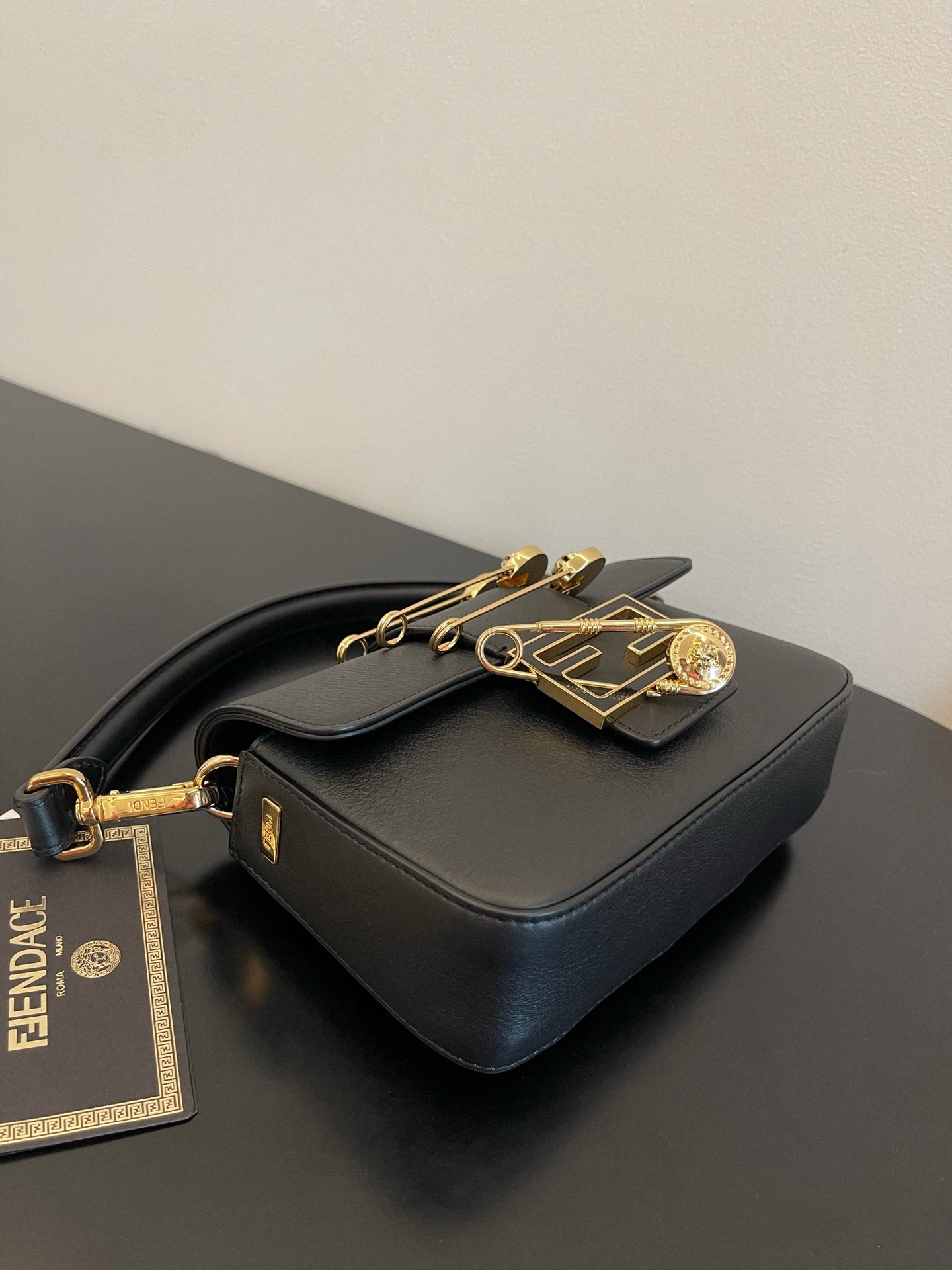 Fendi Black Leather Baguette Bag with Gold Safety Pin Embellishments