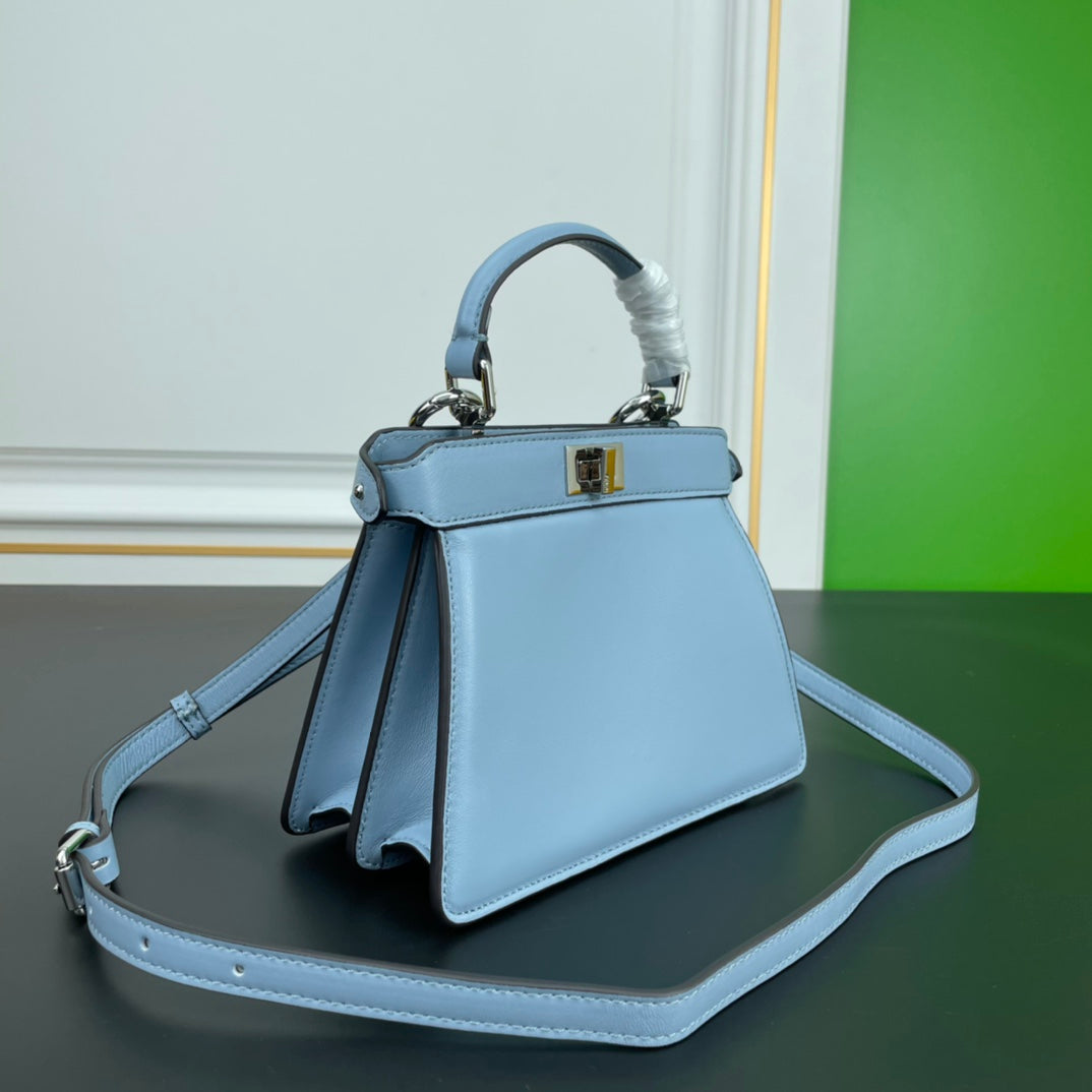 Elegant Light Blue Top Handle Leather Handbag with Adjustable Shoulder Strap