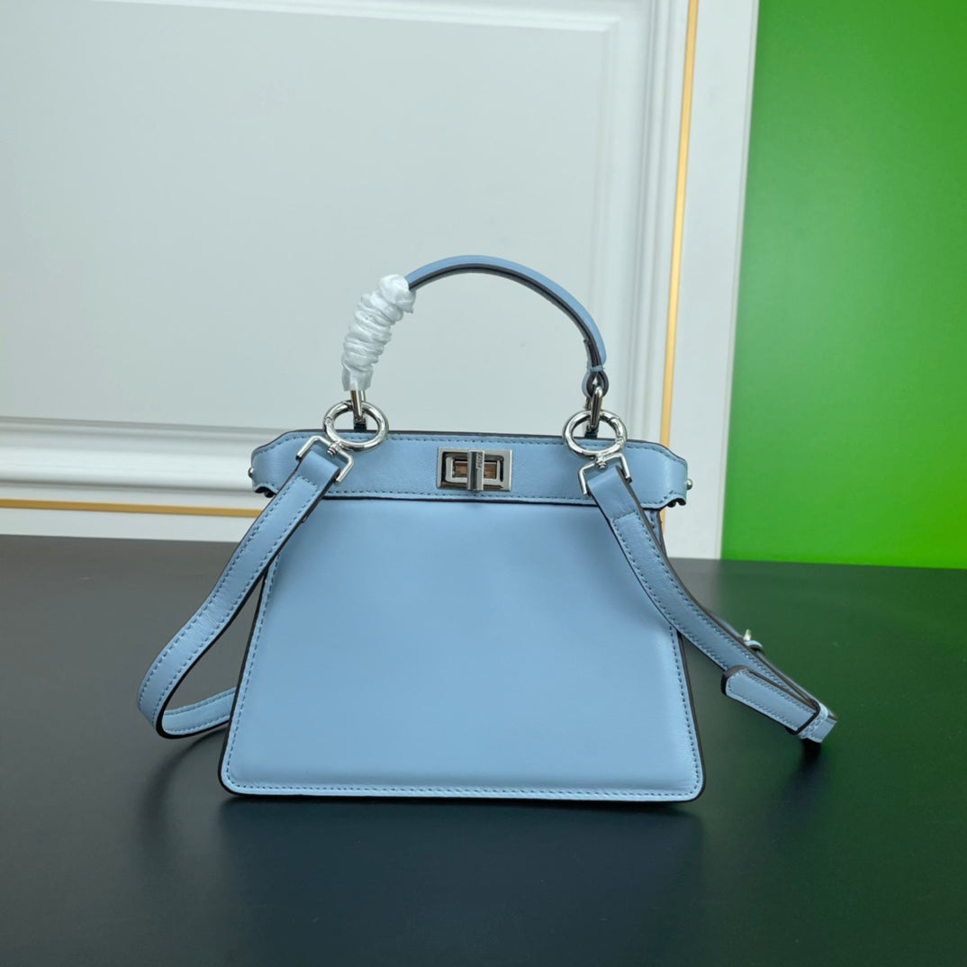 Elegant Light Blue Top Handle Leather Handbag with Adjustable Shoulder Strap