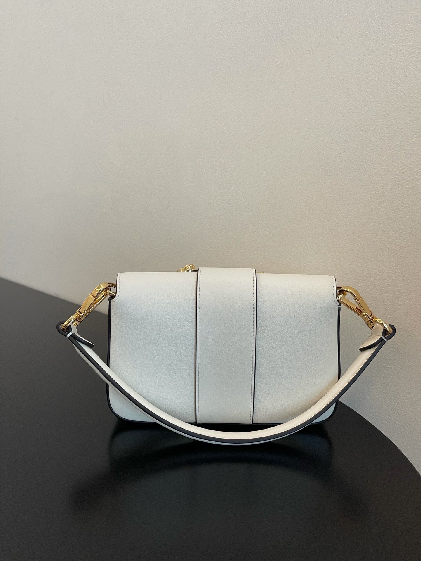 Elegant White Leather Mini Bag with Gold Flower Safety Pin Details