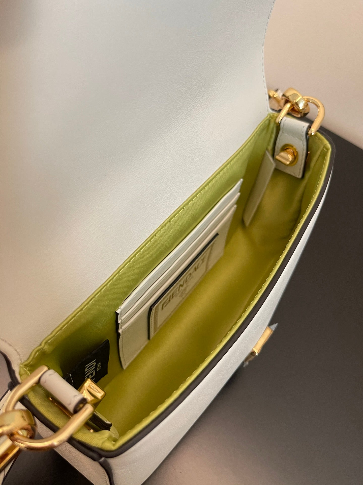 Elegant White Leather Mini Bag with Gold Flower Safety Pin Details