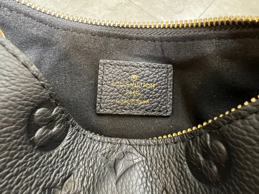 Louis Vuitton Elegant Black Embossed Shoulder Bag with Gold Chain Strap