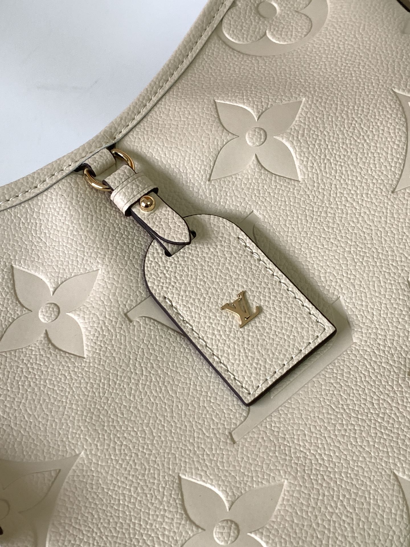 Louis Vuitton Elegant Beige Embossed Leather Shoulder Bag with Hanging Tag