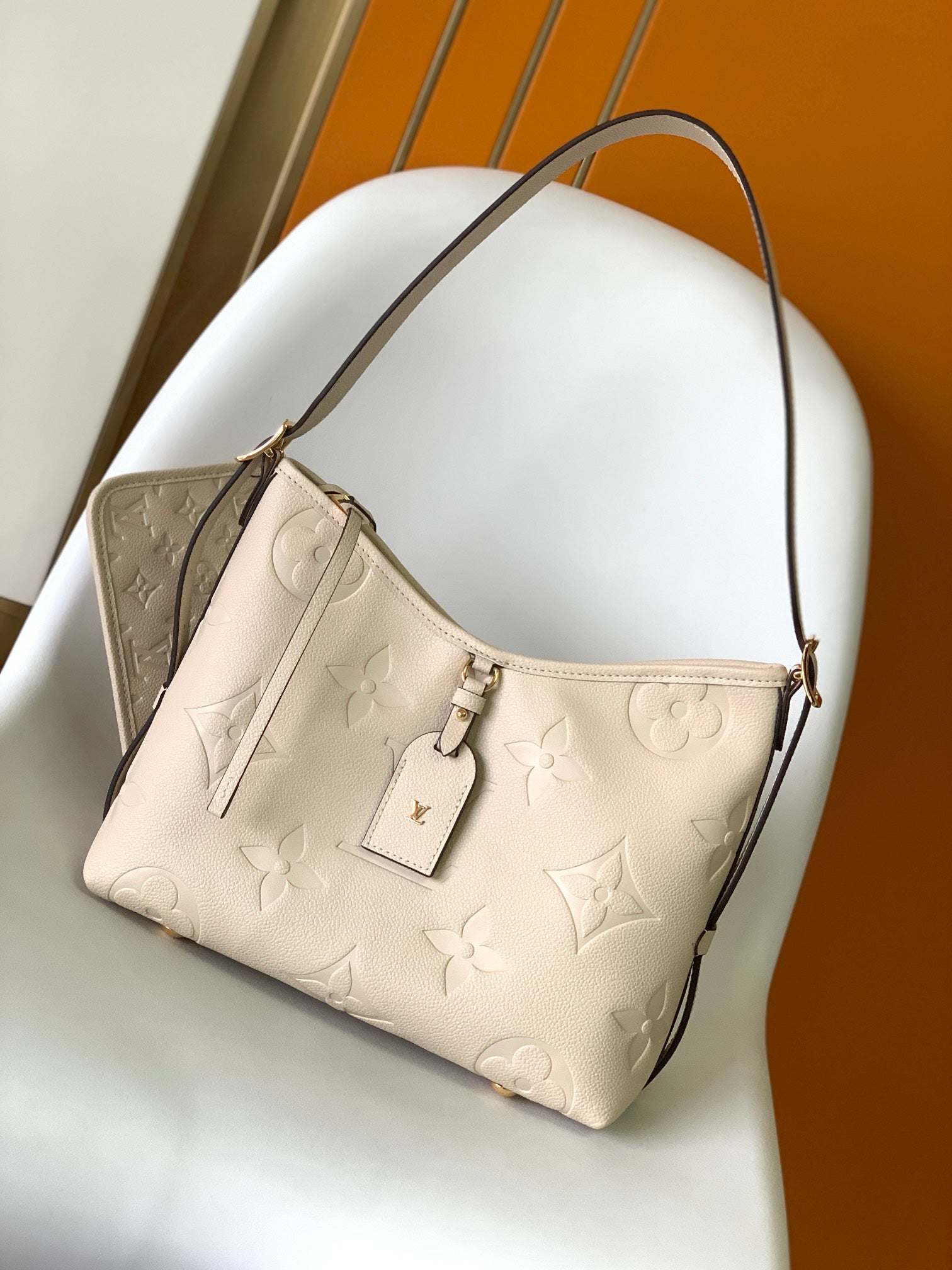 Louis Vuitton Elegant Beige Embossed Leather Shoulder Bag with Hanging Tag