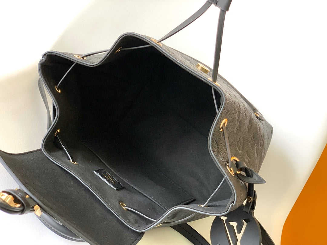 Louis Vuitton Elegant Black Embossed Leather Small Backpack with Flap Closure