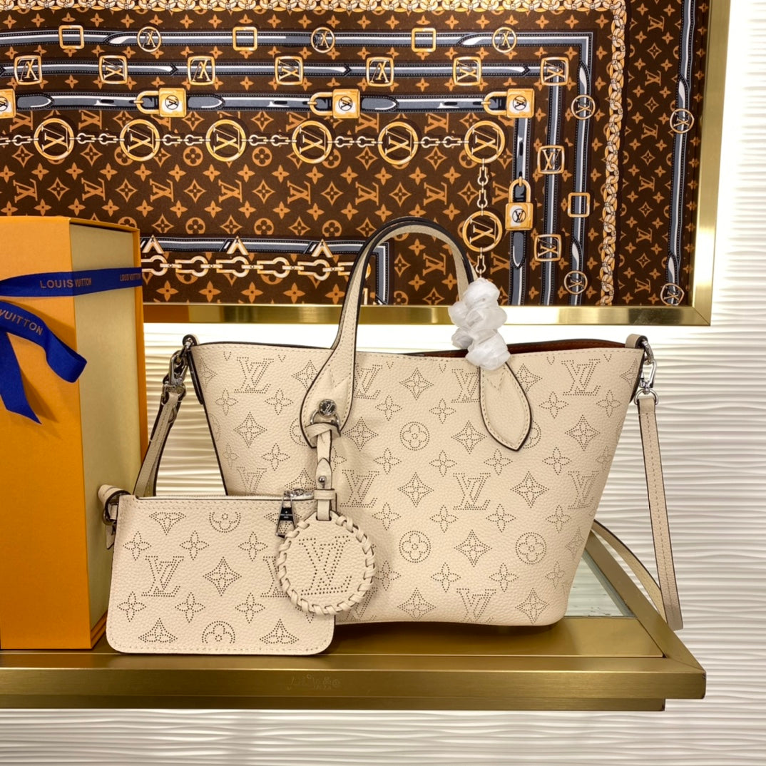 Louis Vuitton Luxury Cream Perforated Leather Tote Bag with Round Charm