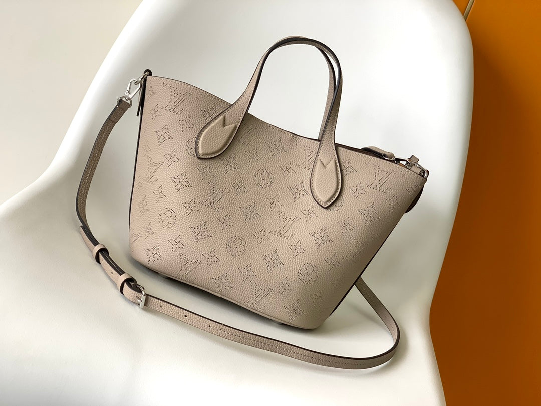 Louis Vuitton Elegant Taupe Perforated Leather Tote Handbag with Charm