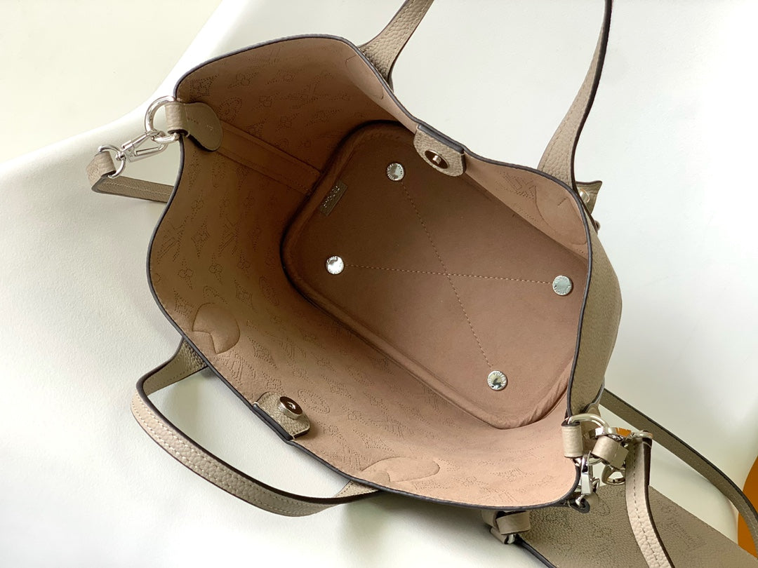 Louis Vuitton Elegant Taupe Perforated Leather Tote Handbag with Charm