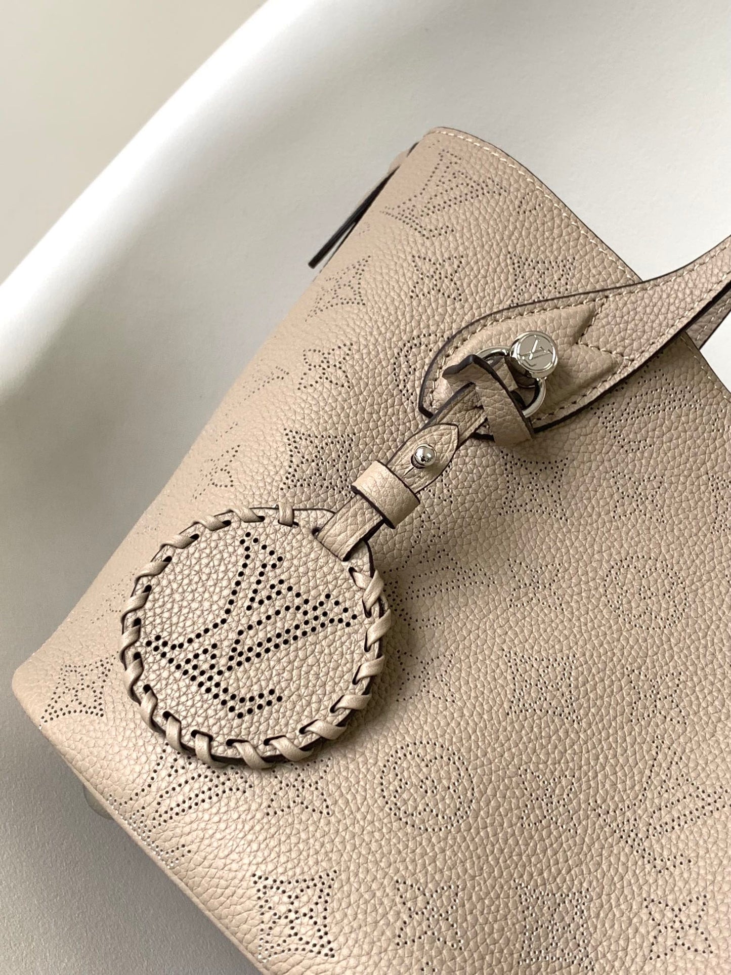 Louis Vuitton Elegant Taupe Perforated Leather Tote Handbag with Charm