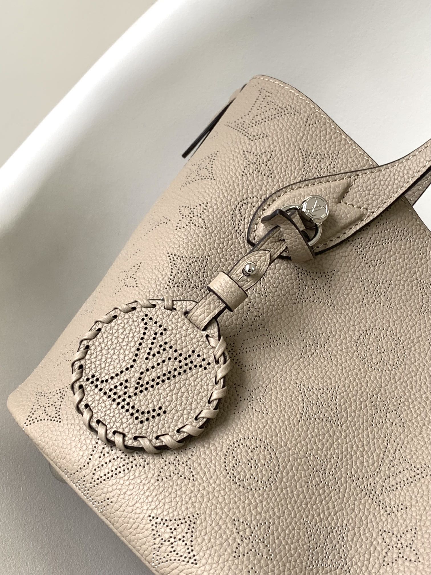 Louis Vuitton Elegant Taupe Perforated Leather Tote Handbag with Charm