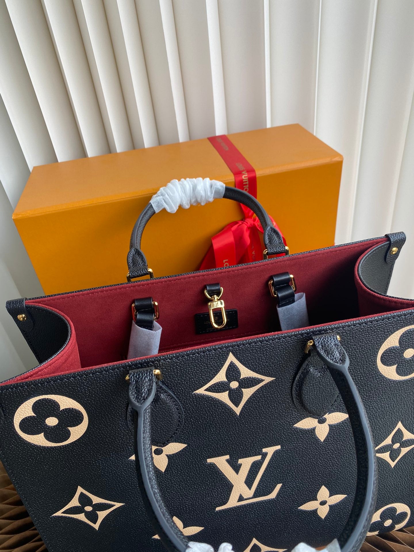Louis Vuitton Luxury Black Leather Tote Bag with Gold Monogram Pattern