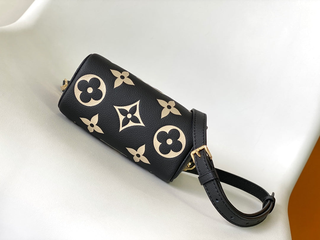 Louis Vuitton Elegant Black Mini Barrel Handbag with Gold Monogram Motifs