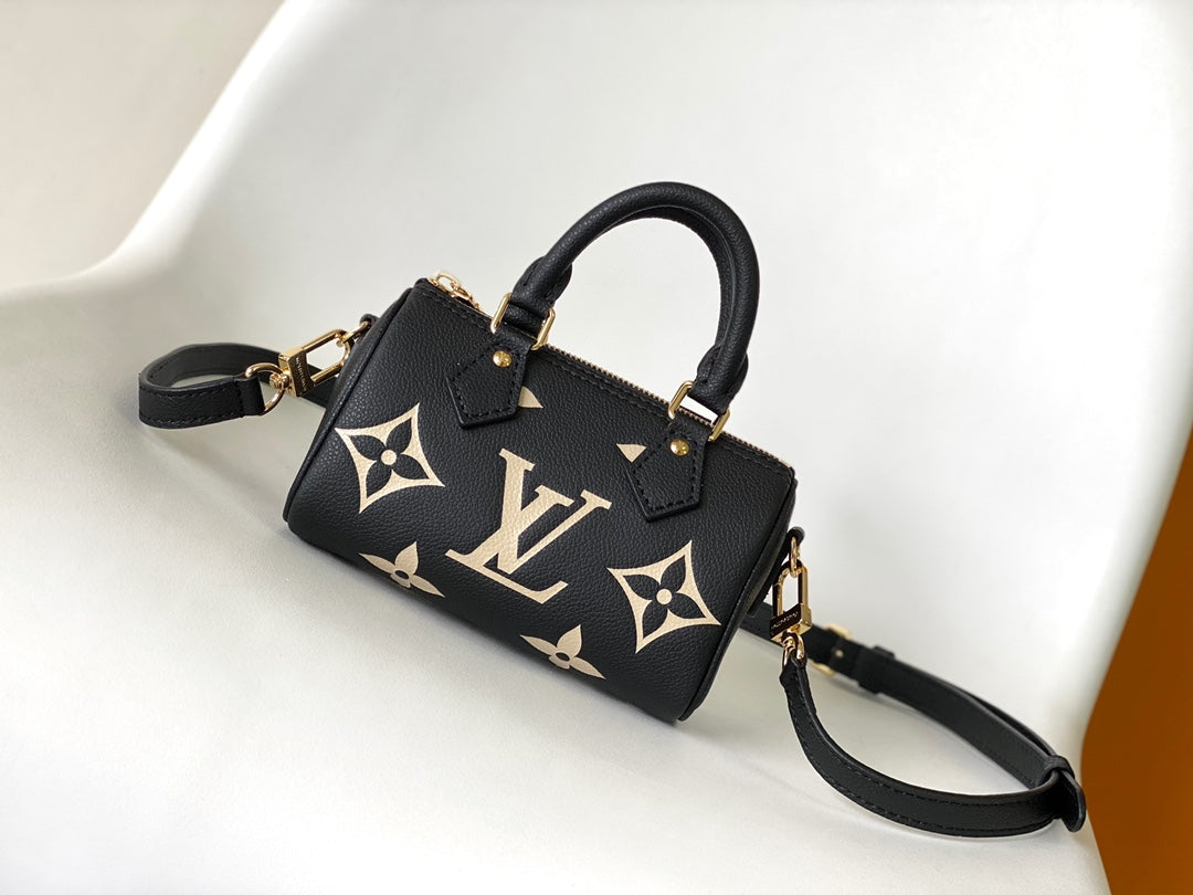 Louis Vuitton Elegant Black Mini Barrel Handbag with Gold Monogram Motifs