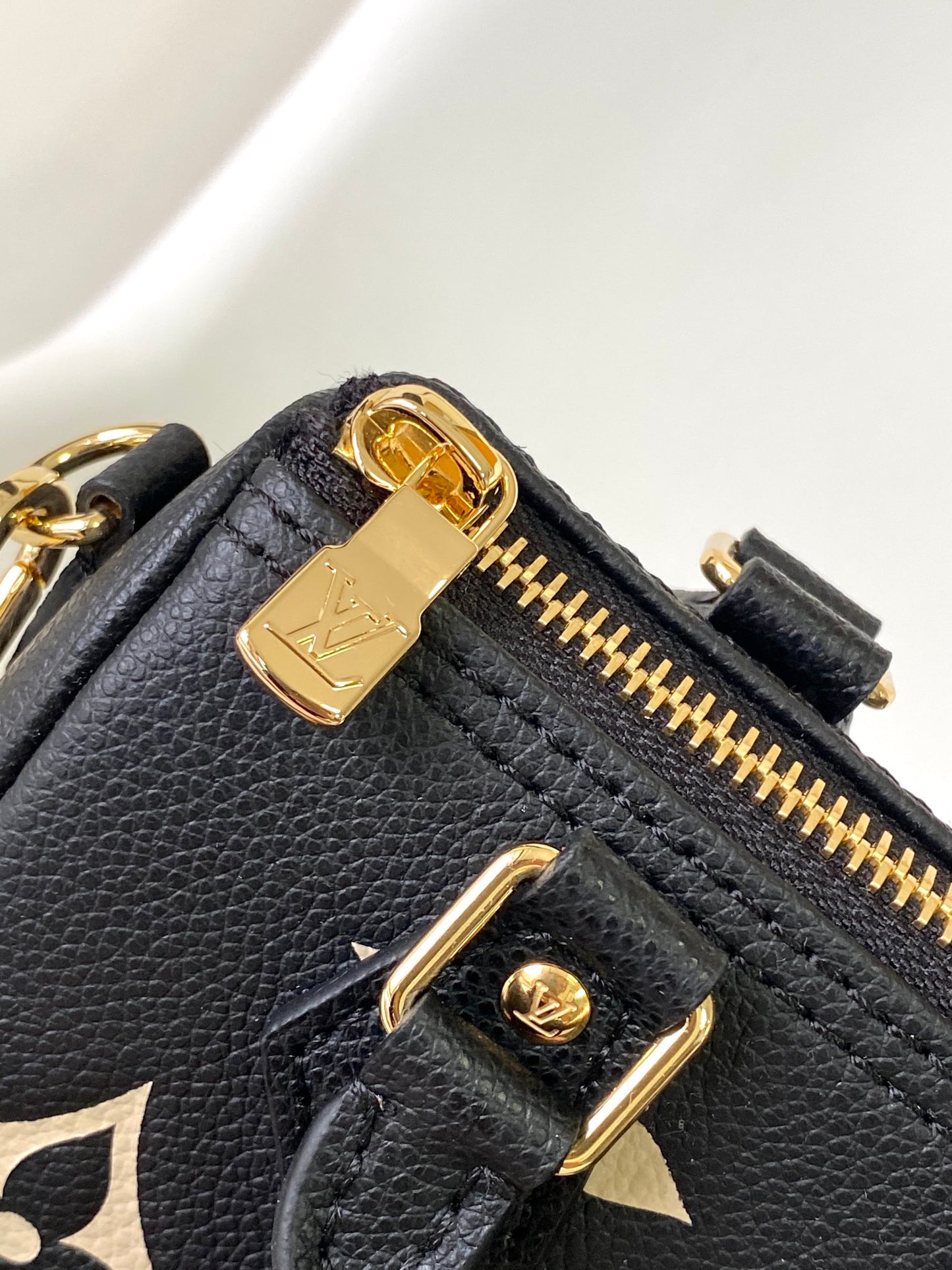 Louis Vuitton Elegant Black Mini Barrel Handbag with Gold Monogram Motifs
