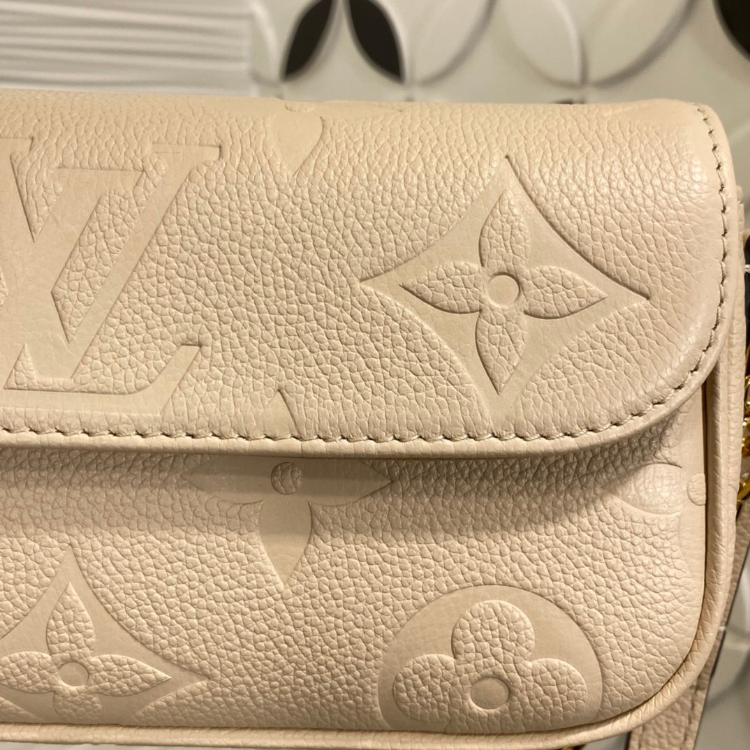 Louis Vuitton Elegant Beige Embossed Leather Shoulder Bag with Gold Chain
