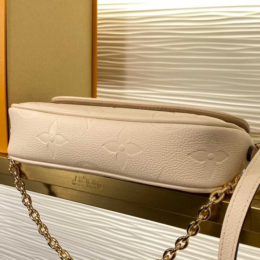 Louis Vuitton Elegant Beige Embossed Leather Shoulder Bag with Gold Chain