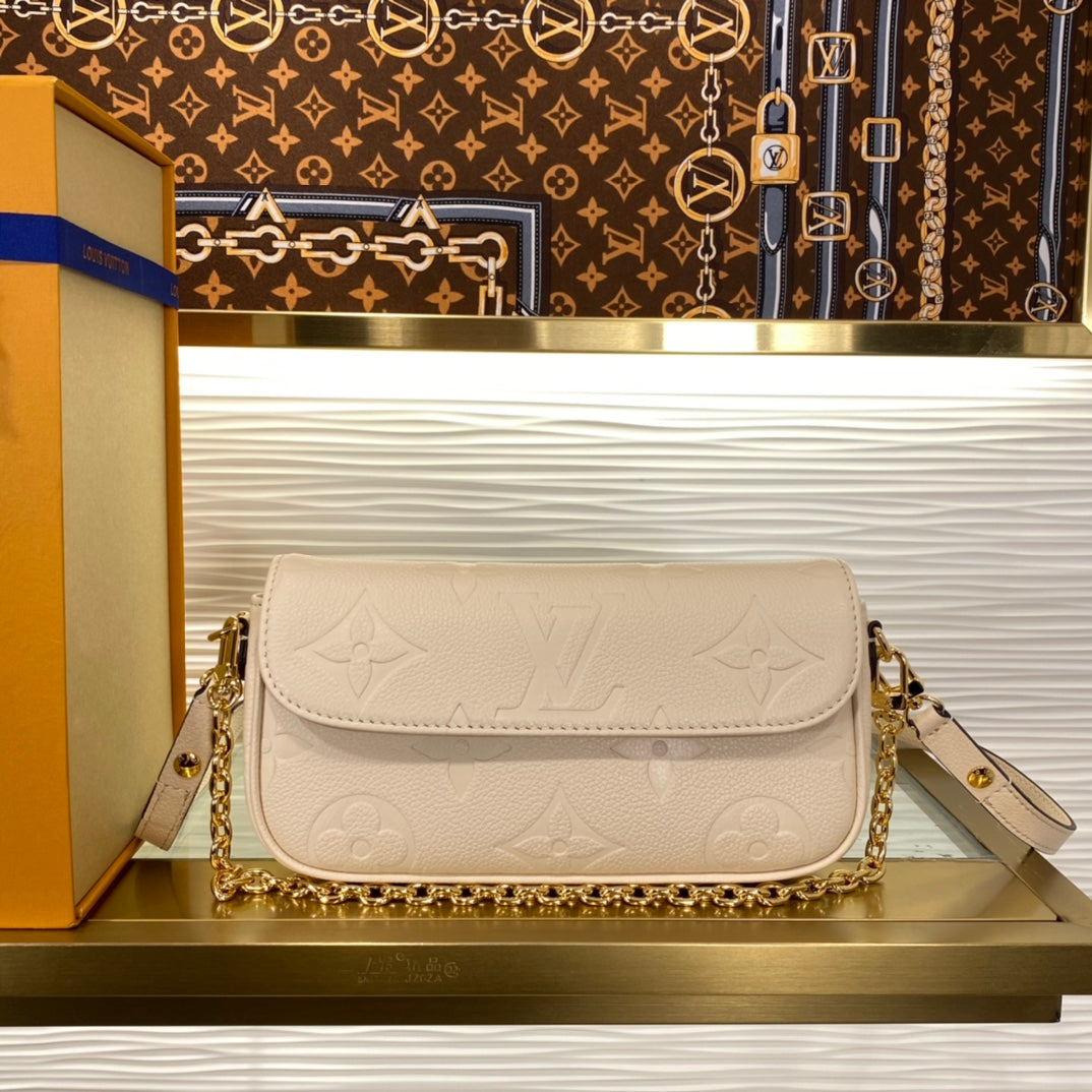 Louis Vuitton Elegant Beige Embossed Leather Shoulder Bag with Gold Chain