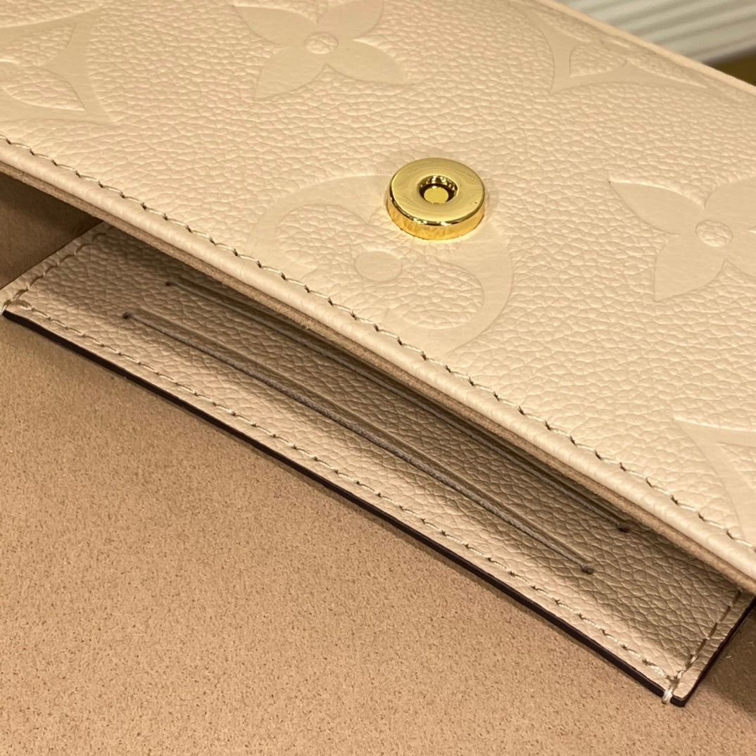 Louis Vuitton Elegant Beige Embossed Leather Shoulder Bag with Gold Chain