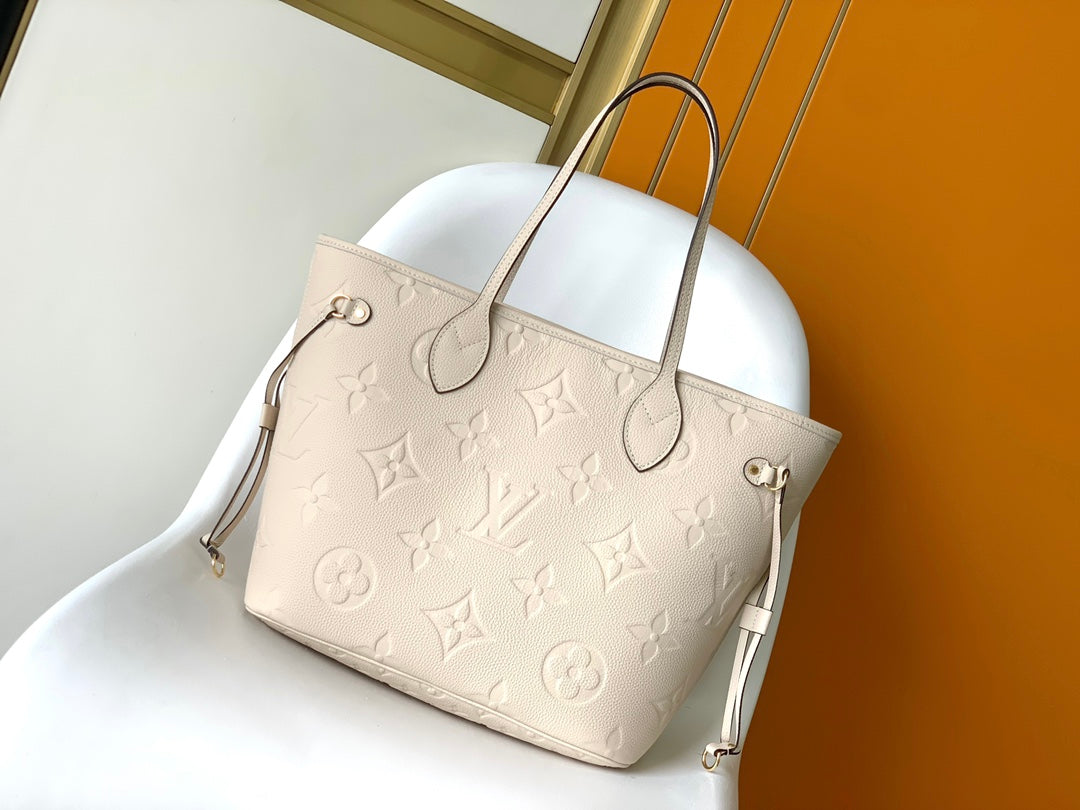 Louis Vuitton Elegant Beige Embossed Leather Tote Bag with Side Drawstrings