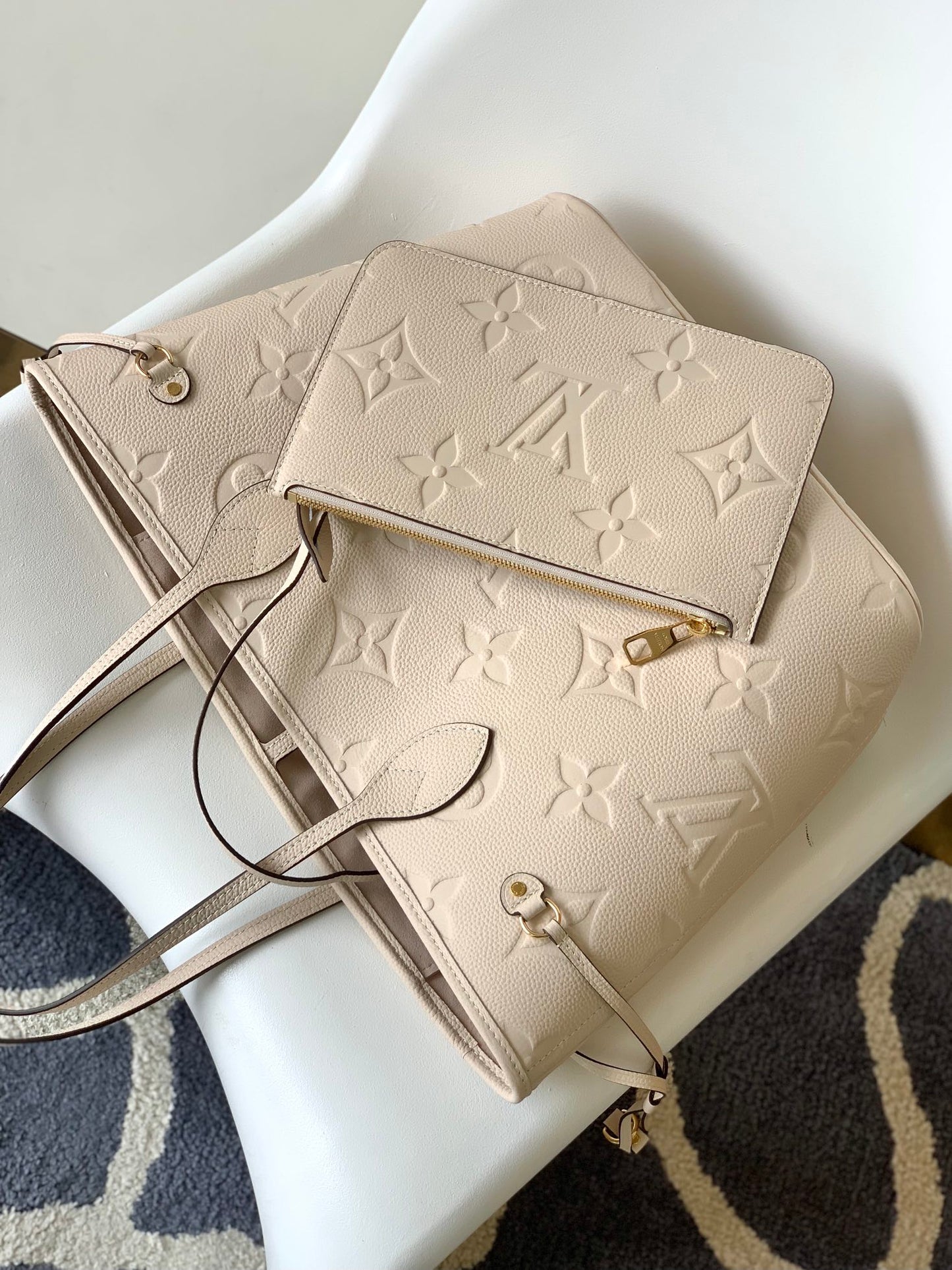 Louis Vuitton Elegant Beige Embossed Leather Tote Bag with Side Drawstrings