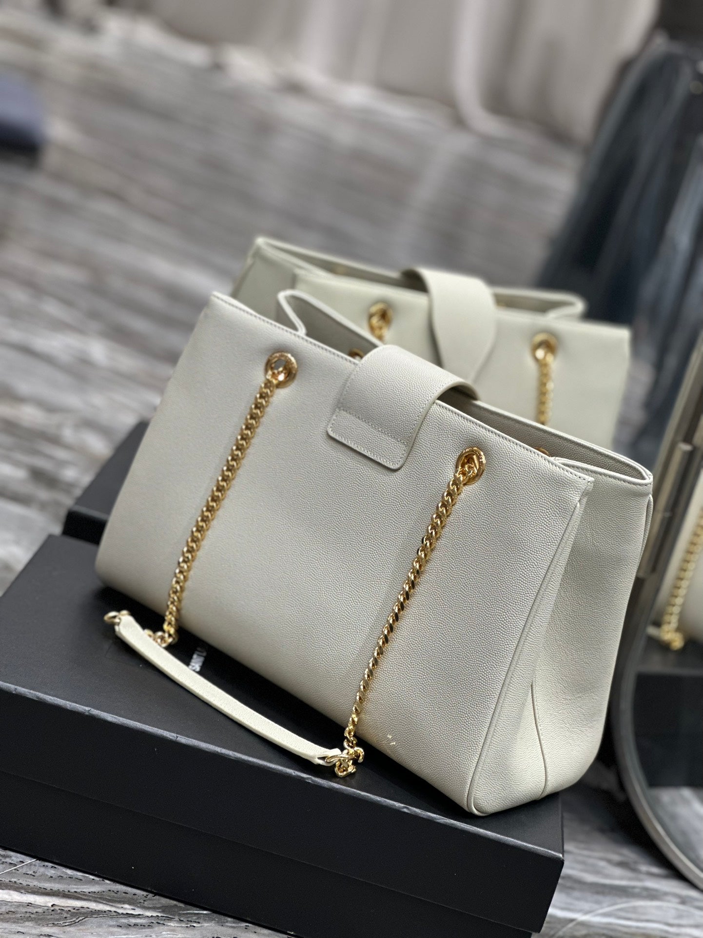 Luxury Off-White Leather Shoulder Bag with Gold Chain and Tassel