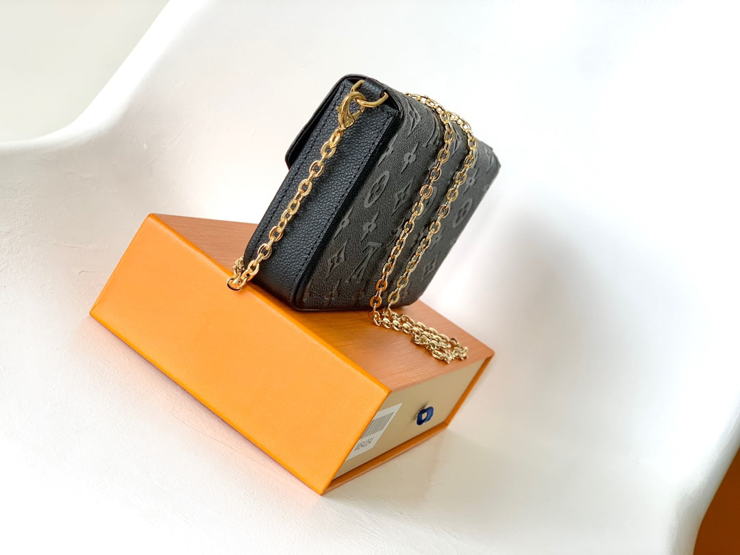 Louis Vuitton Black Monogram Embossed Leather Crossbody Clutch Bag with Gold Chain
