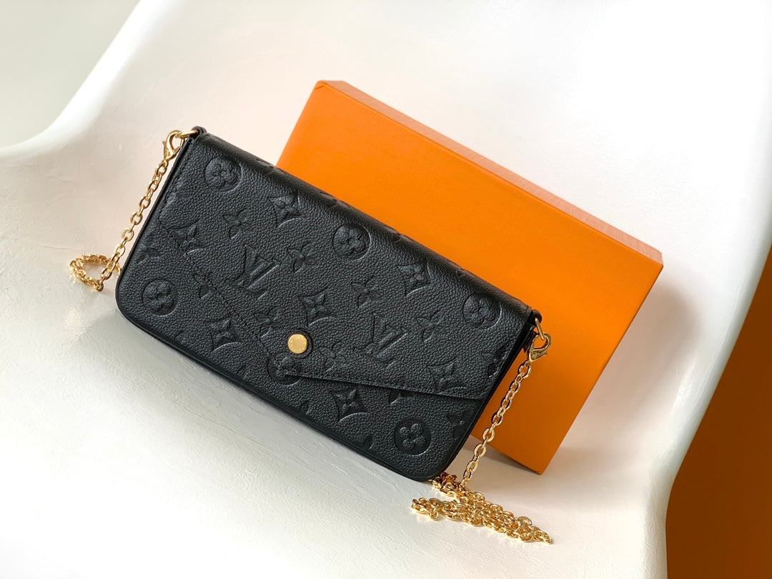 Louis Vuitton Black Monogram Embossed Leather Crossbody Clutch Bag with Gold Chain