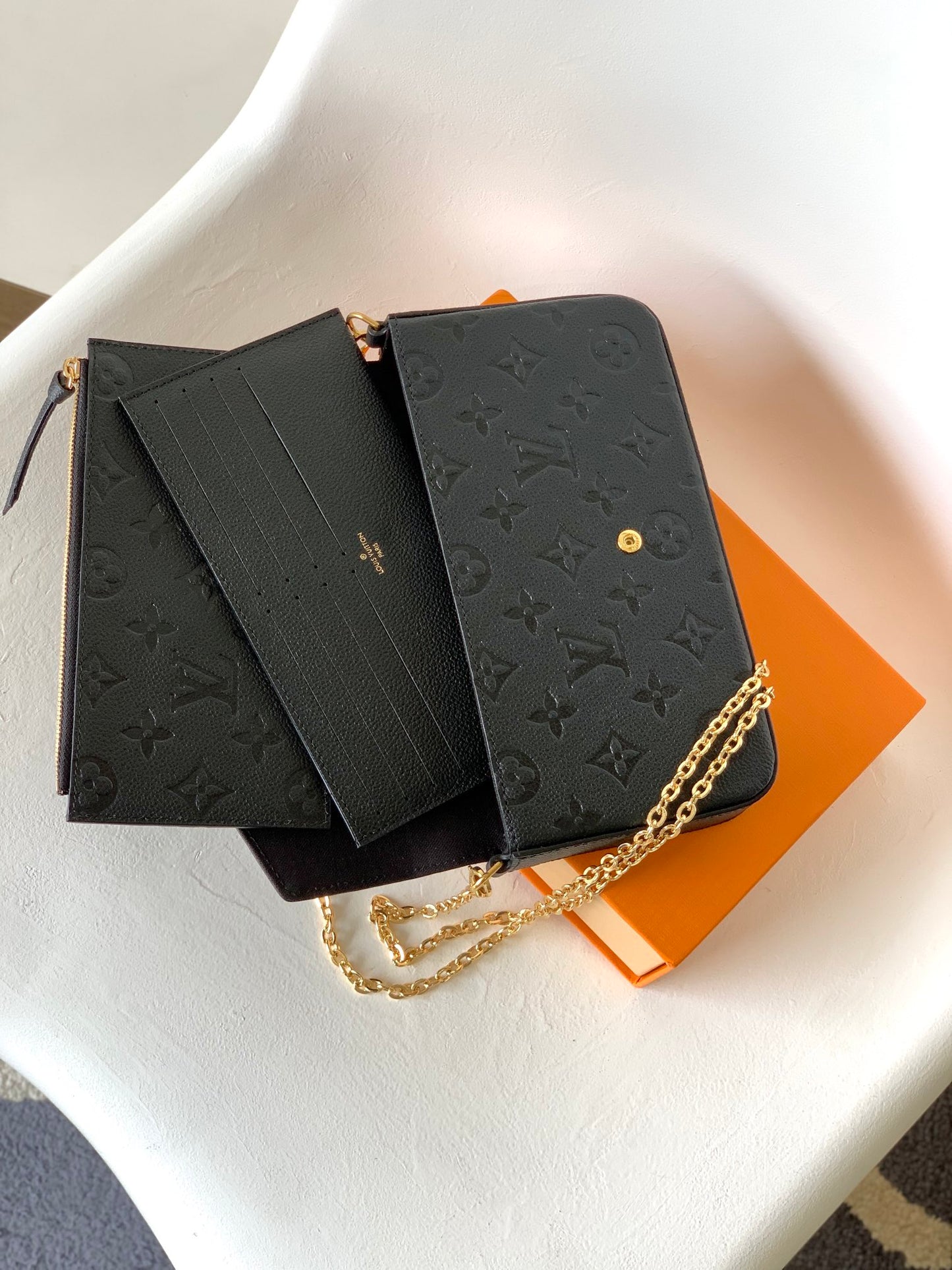 Louis Vuitton Black Monogram Embossed Leather Crossbody Clutch Bag with Gold Chain